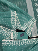 Mint cotton jamdani saree with white threads work all over work and blouse piece.