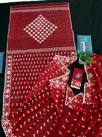 Maroon jamdani saree with white thread work.