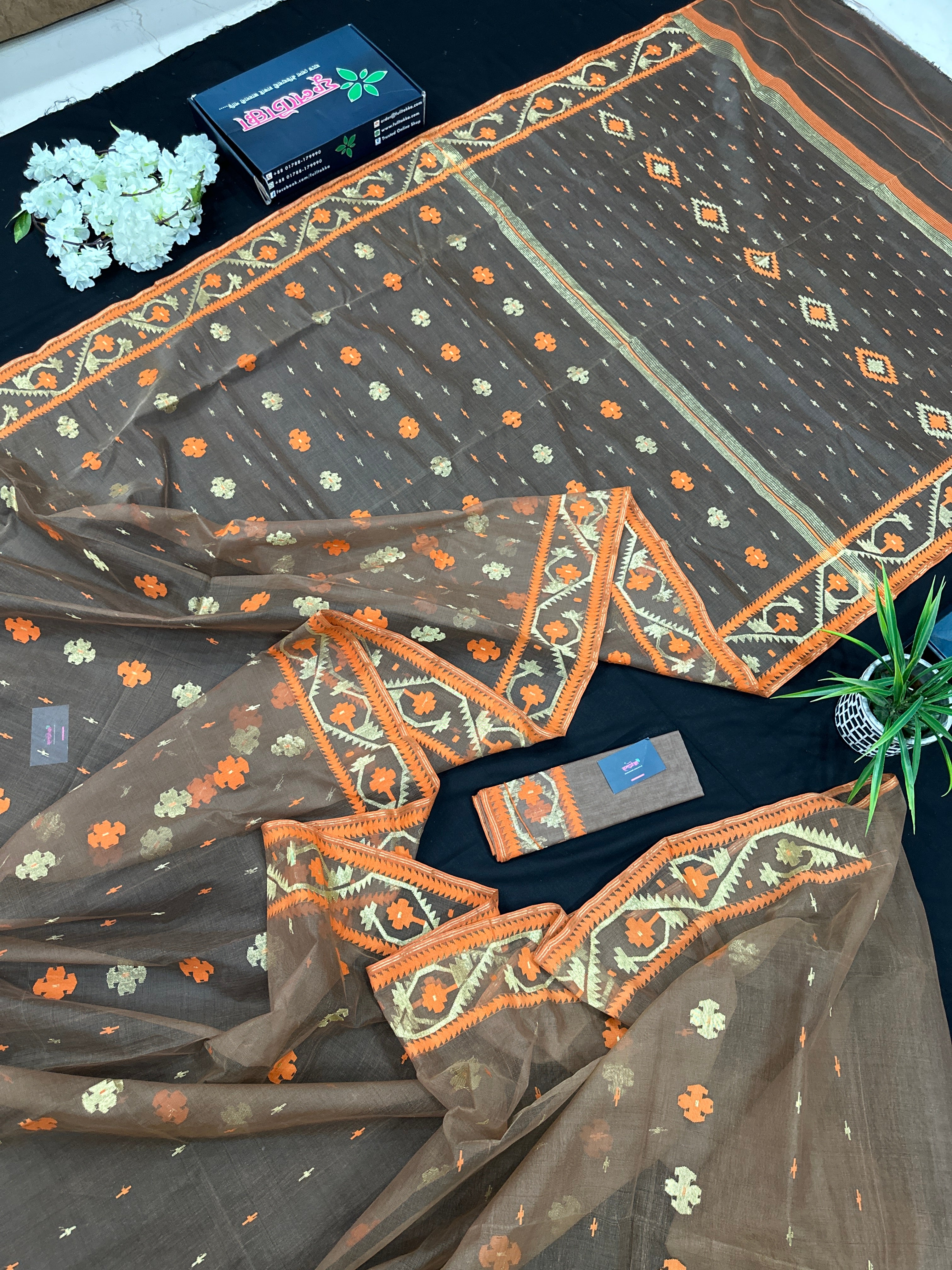 Peanut Brown dhakai jamdani saree with orange threads work & golden jori work all over soft count.