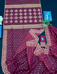 Maroon cotton jamdani with yellowish threads work.