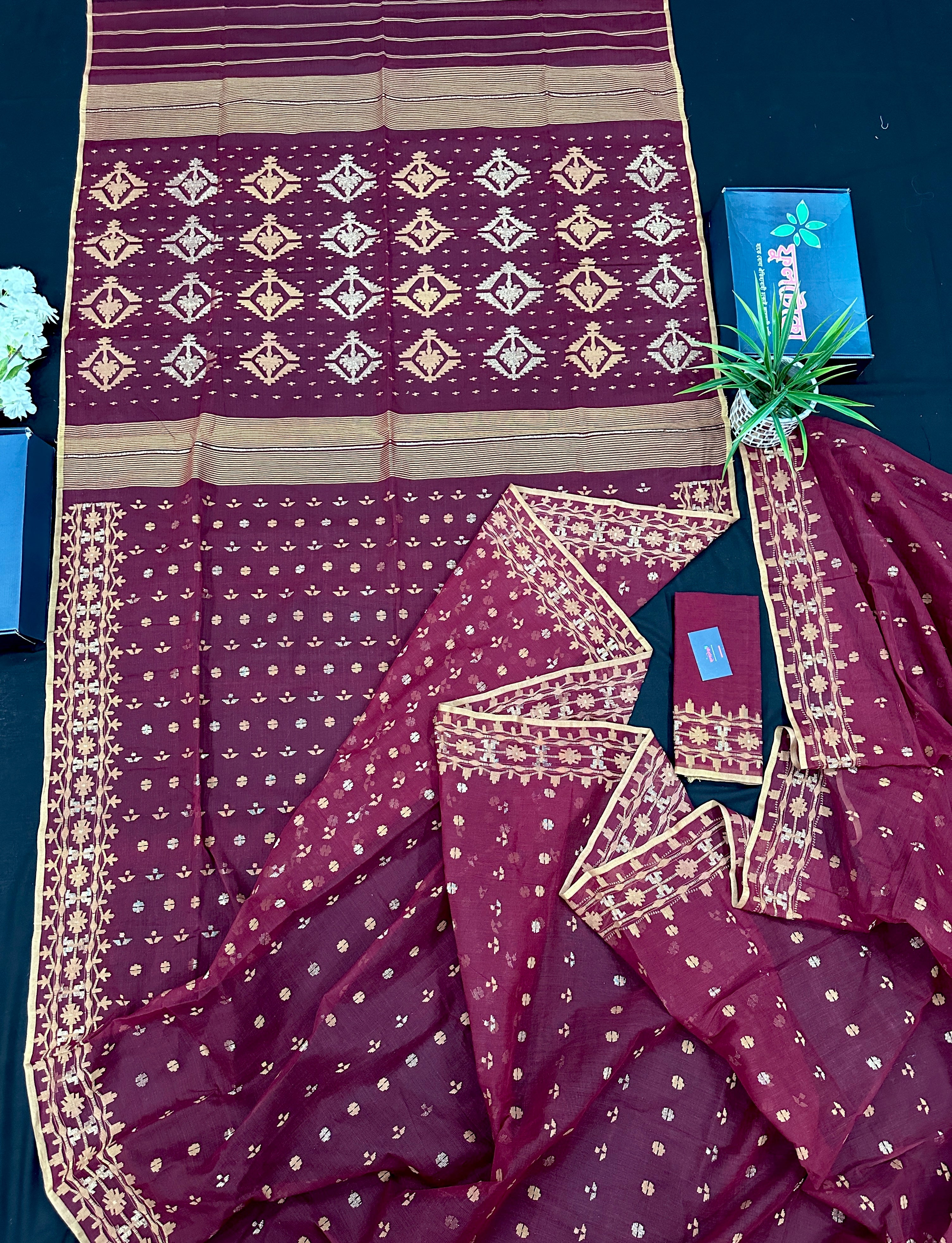 Maroon cotton jamdani with yellowish threads work.
