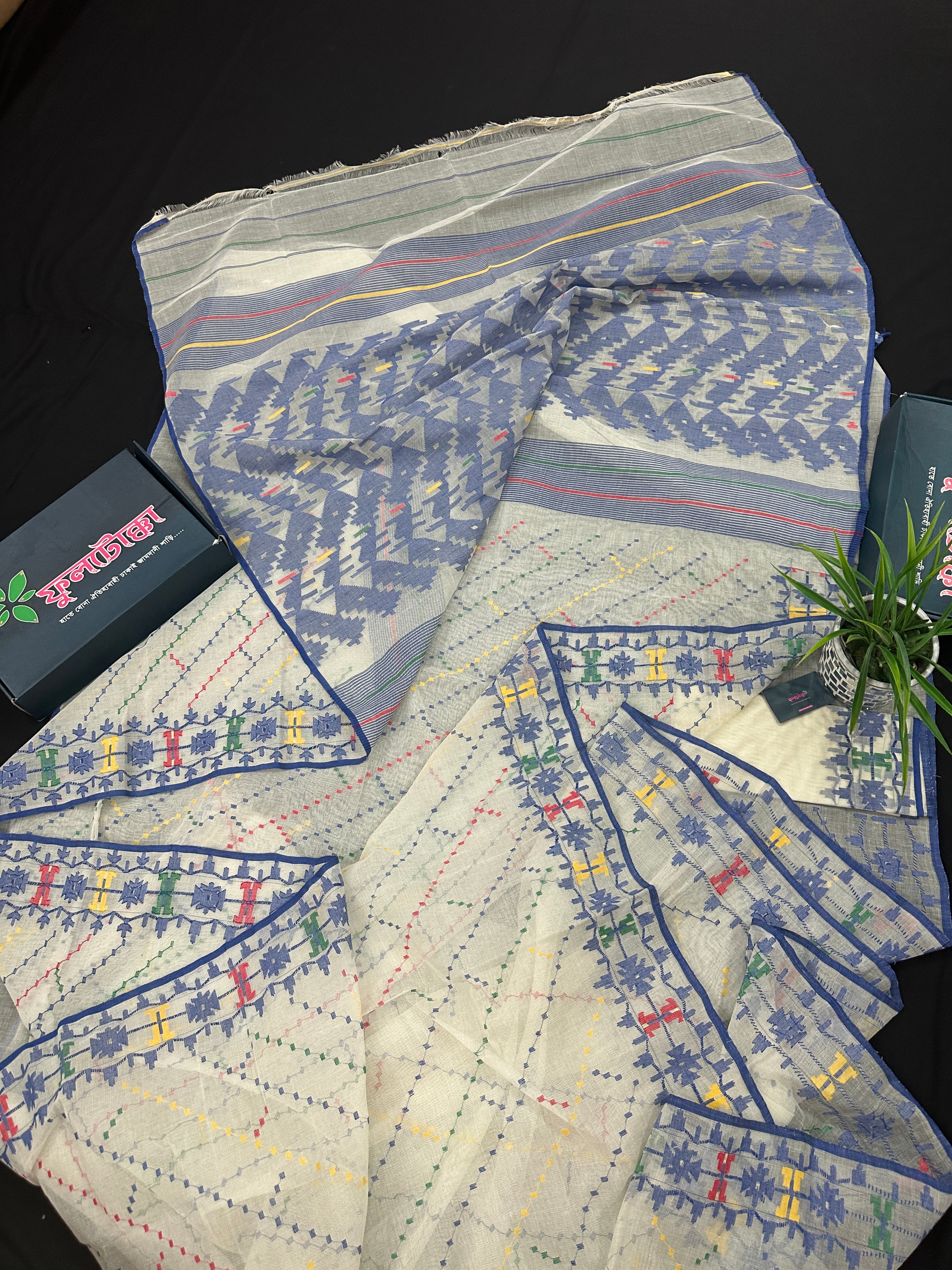 White cotton jamdani saree with blue yellow red green threads work& blouse piece.