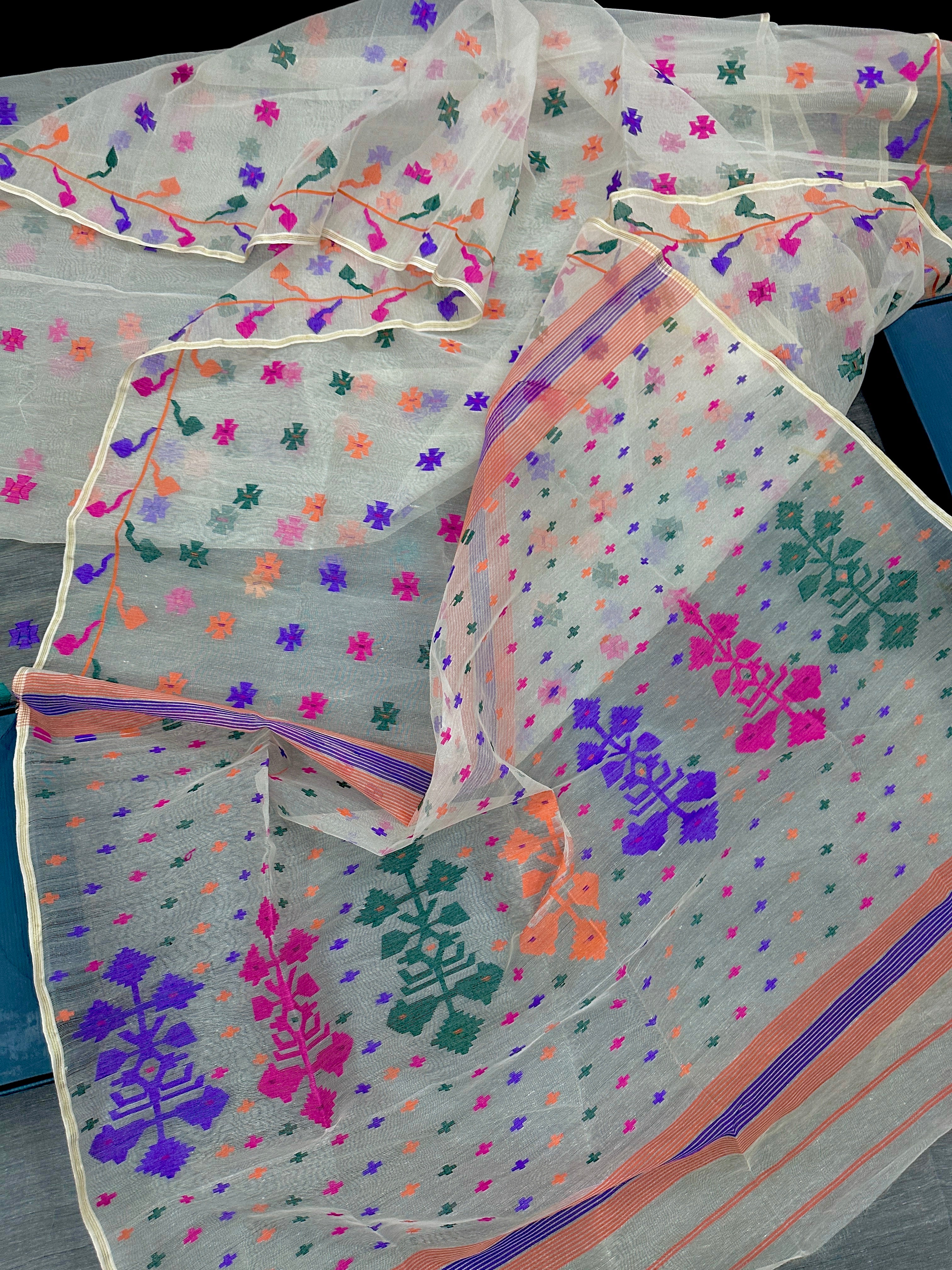 White jamdani saree with purple pink green orange threads work.