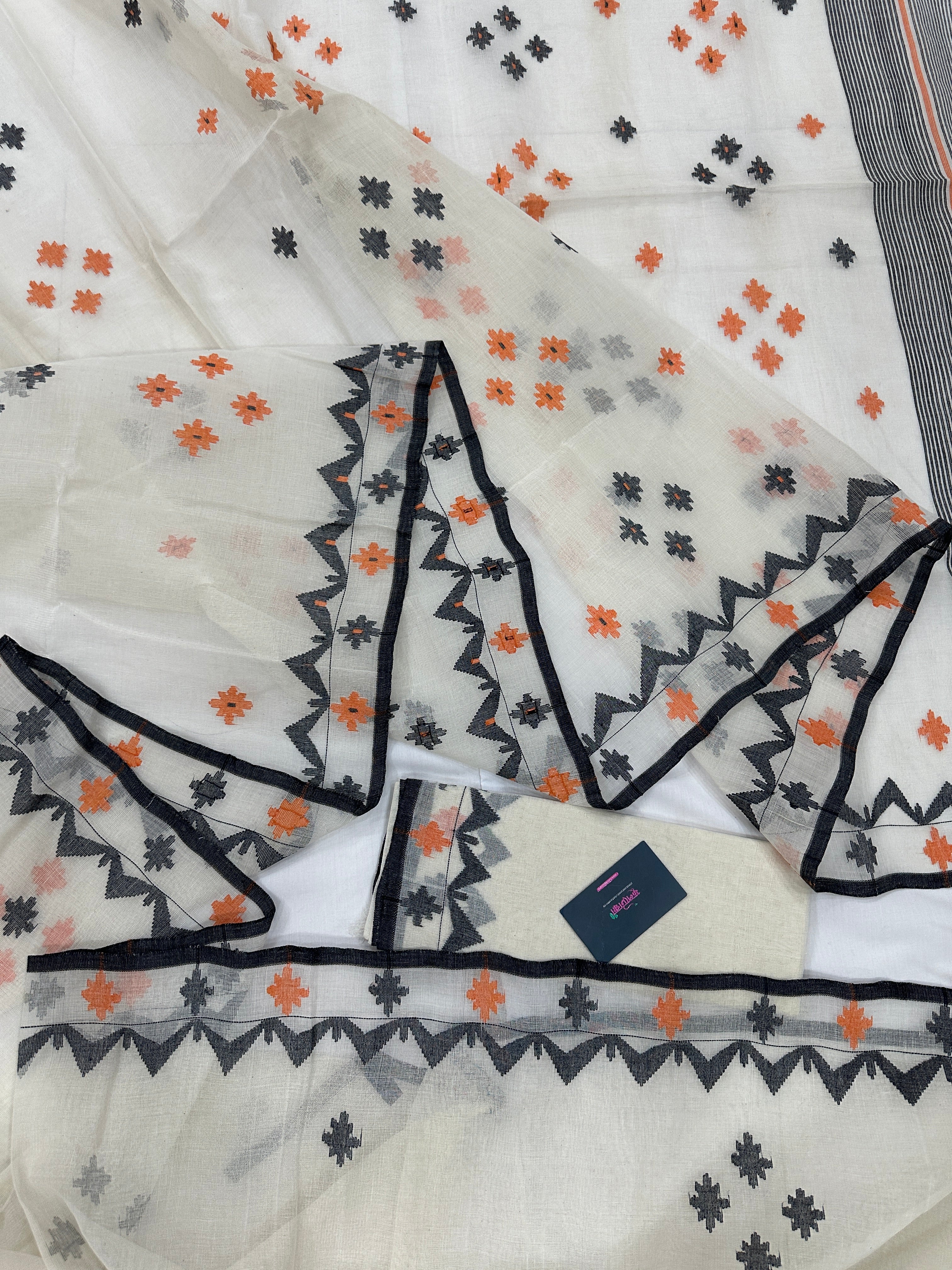 White cotton jamdani saree with orange & black threads work.
