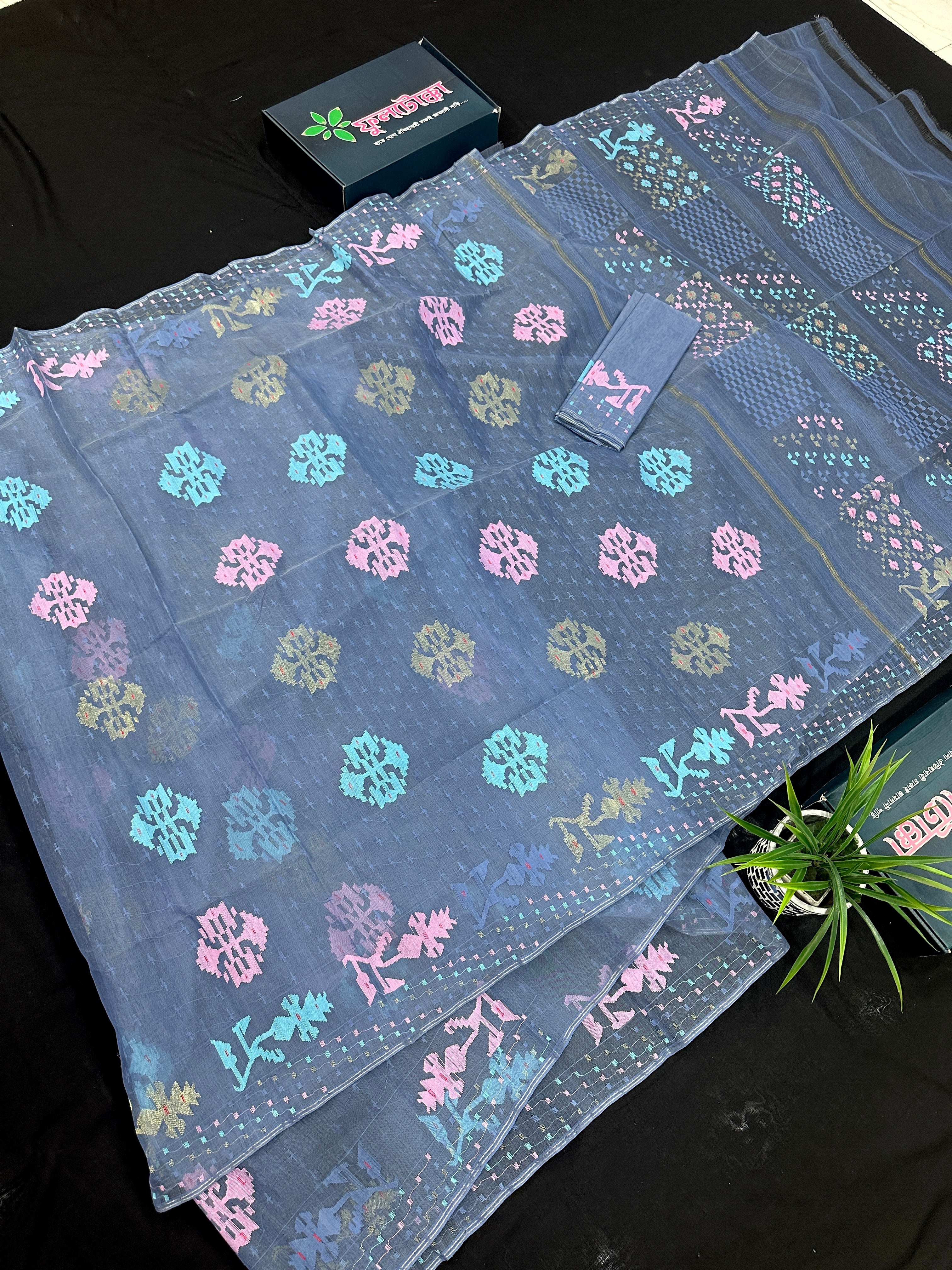 Powdery blue jamdani saree with pink blue and golden jori work.