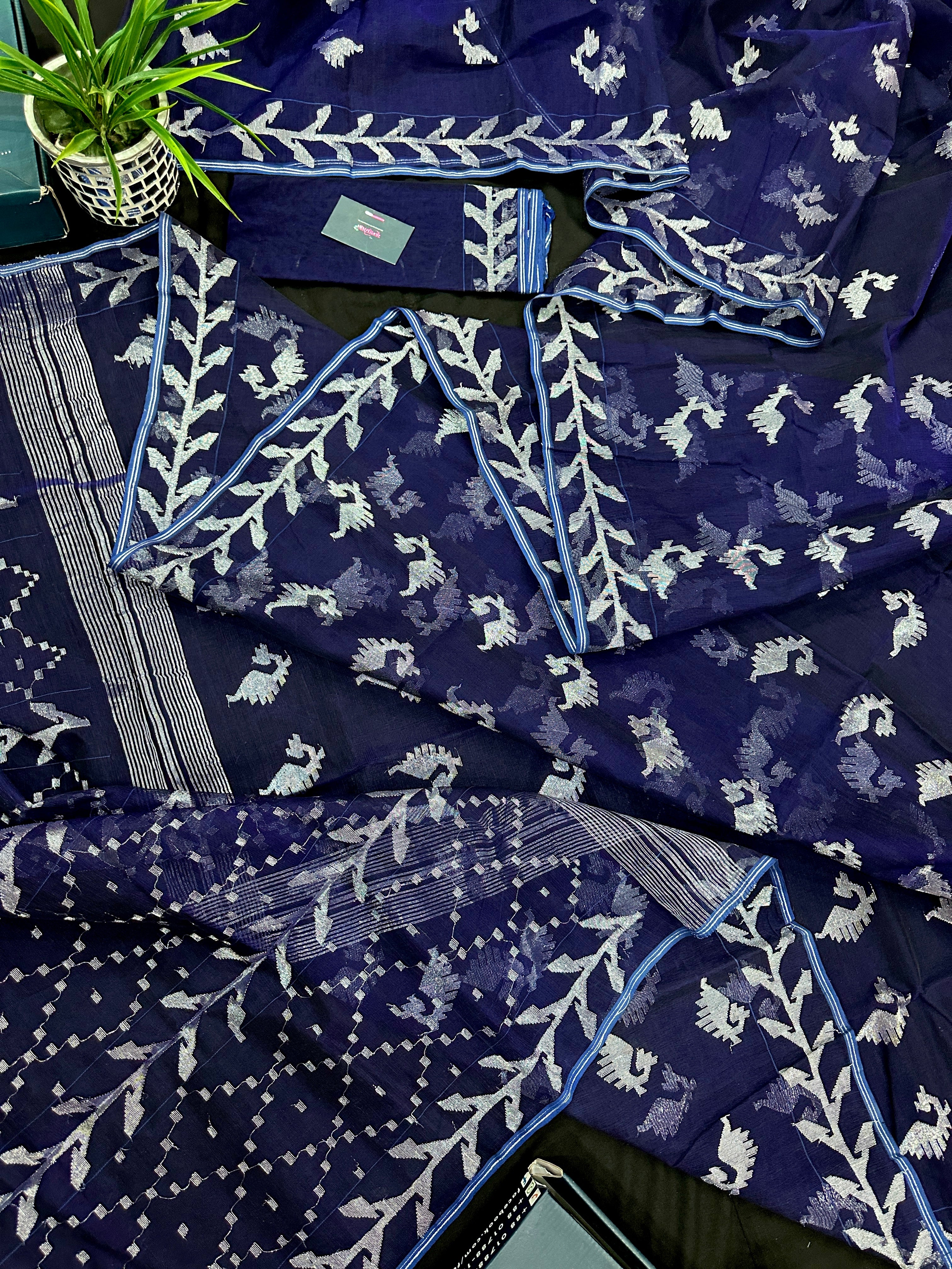 Navy blue jamdani saree with silver jori work soft threads all over work.