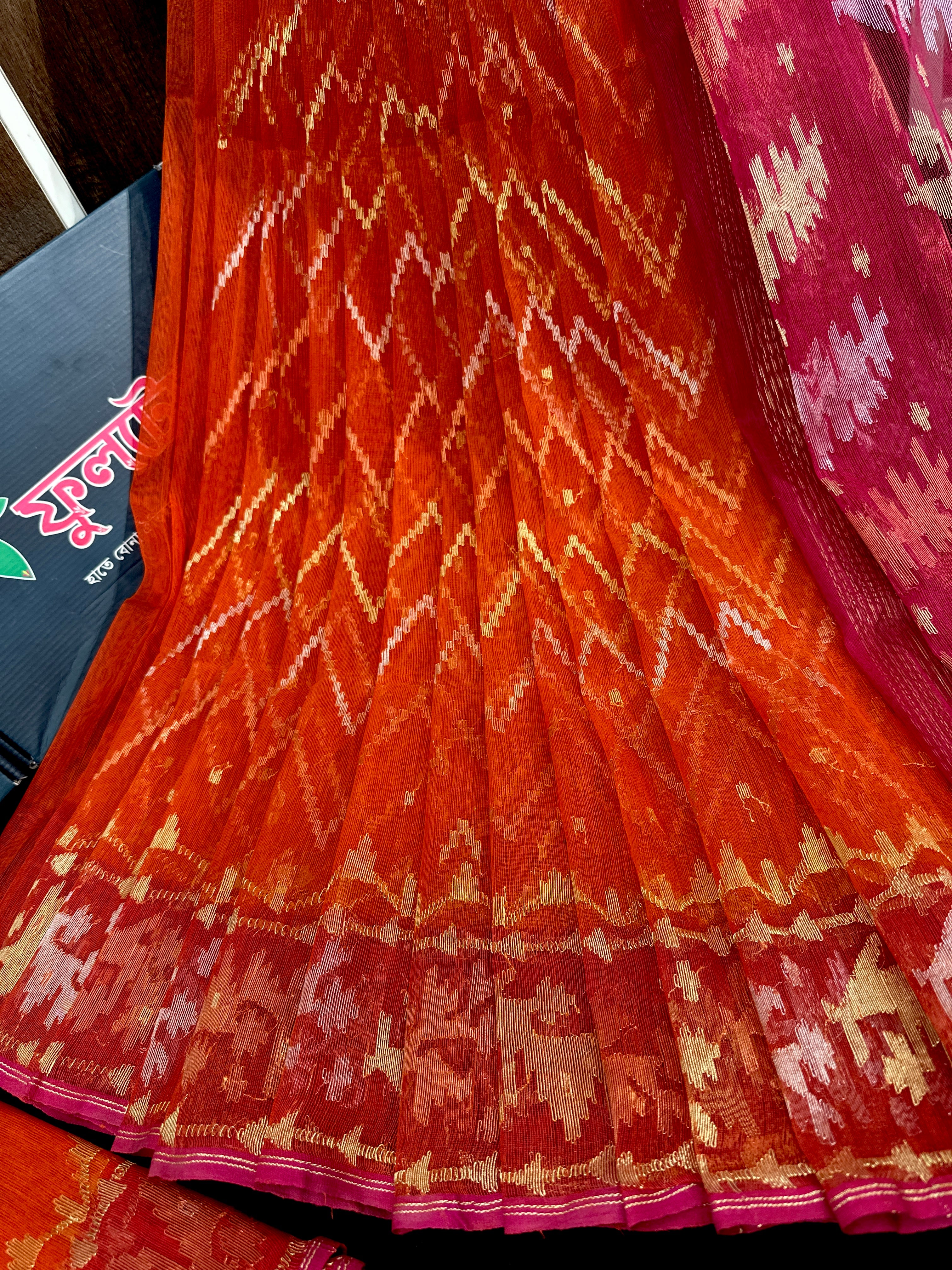 Orange halfsilk jamdani with magenta paar and golden silver & copper jori work