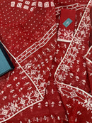 Maroon jamdani saree with white thread work.