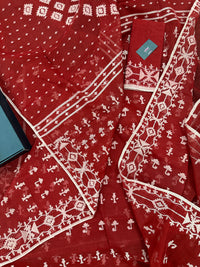 Maroon jamdani saree with white thread work.