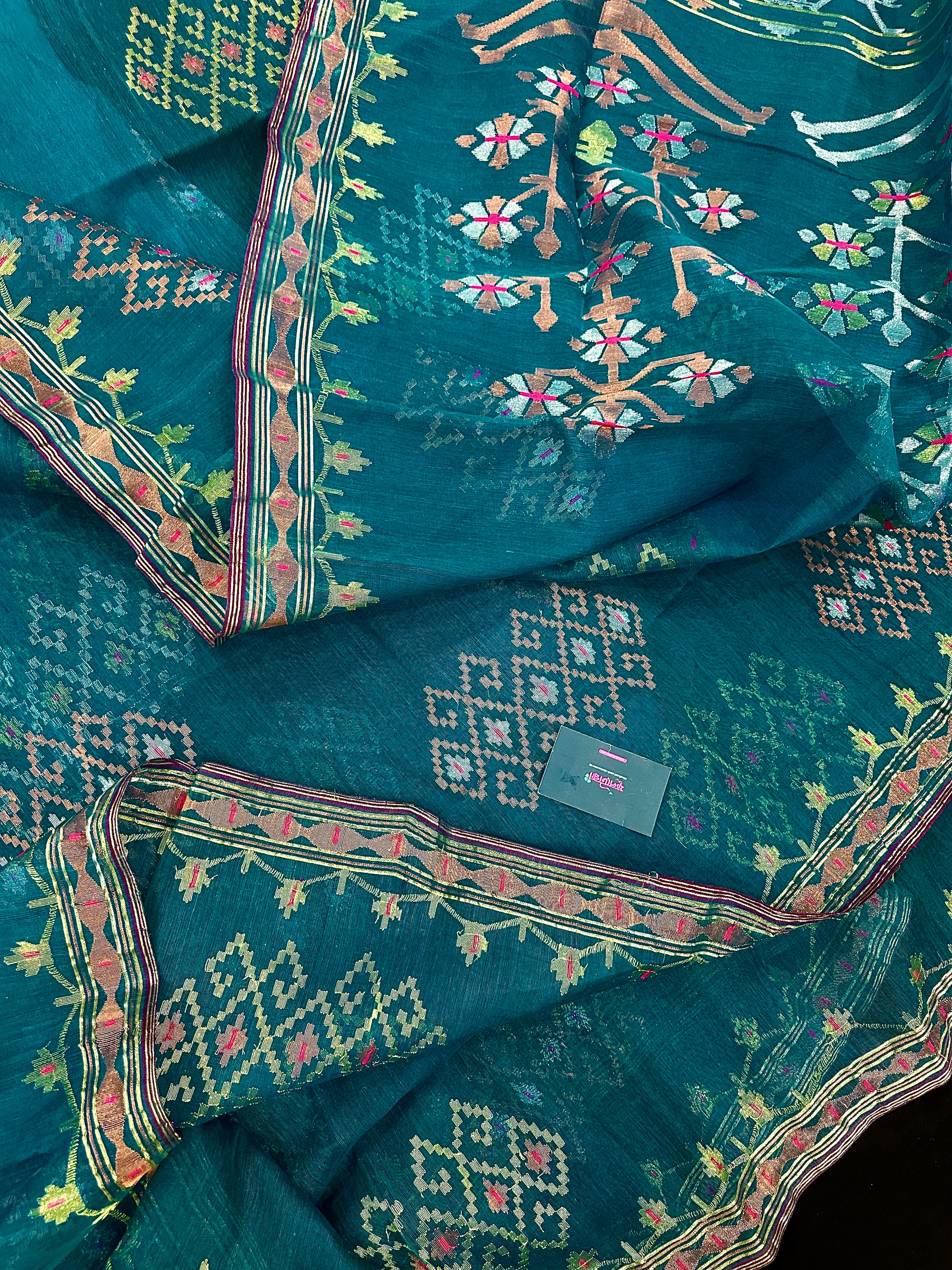 Sea green jamdani saree with golden silver & copper jori work soft count.