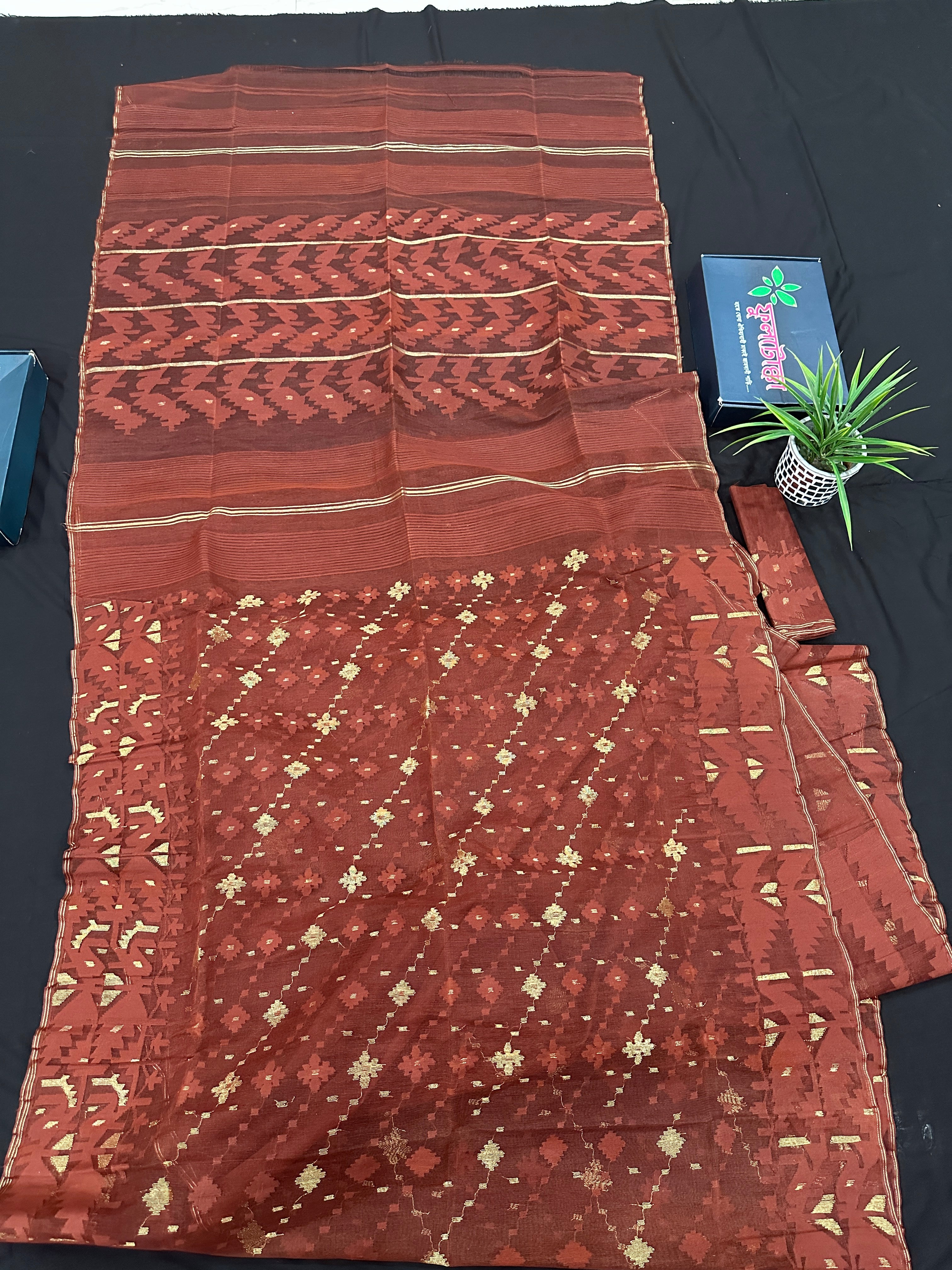 Mehendi brown jamdani saree with golden work.