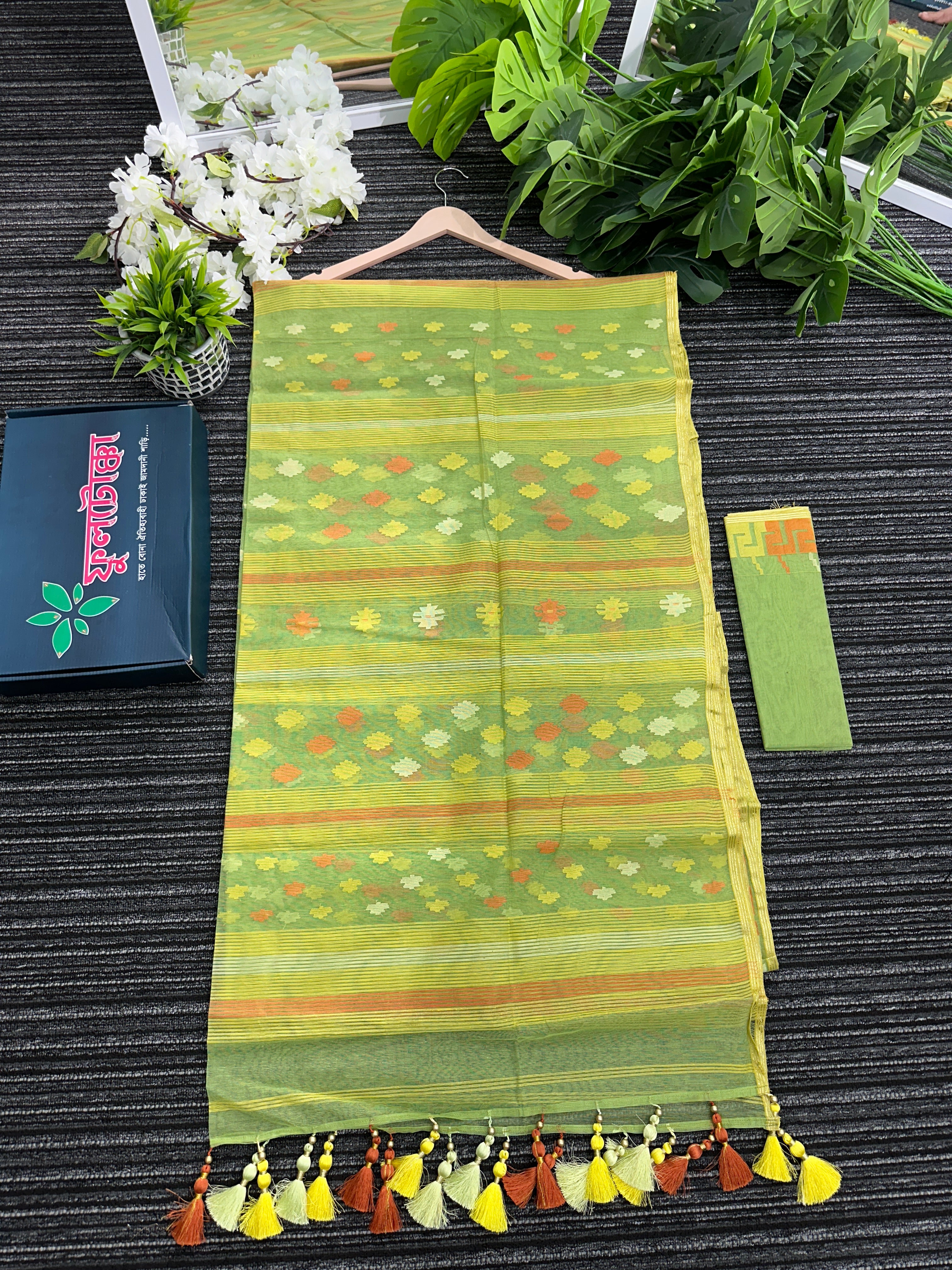 Olive green halfsilk jamdani saree with orange and olive threads work