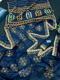 Navy blue jamdani saree with orange  green & off white threads work.