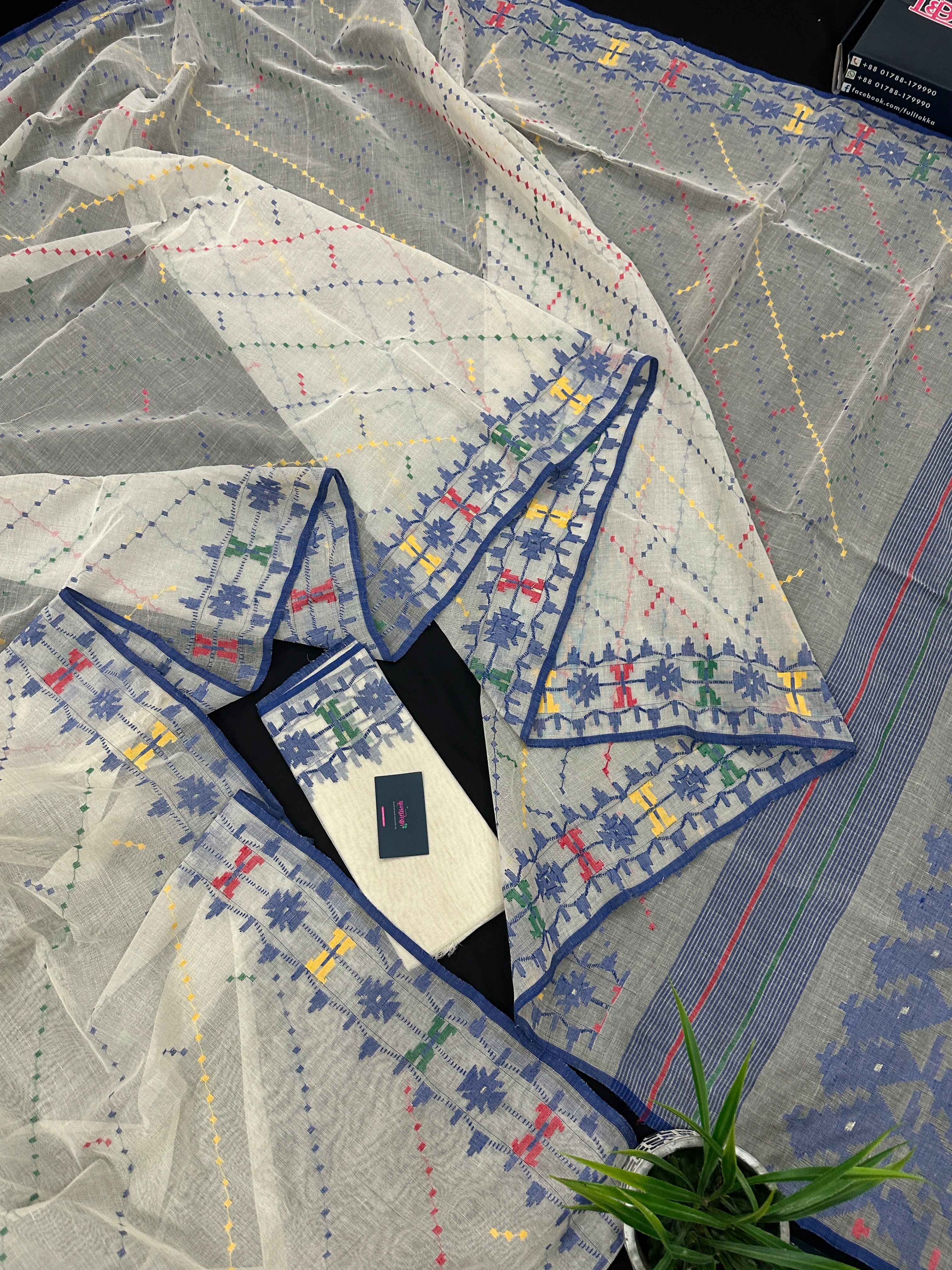 White cotton jamdani saree with blue yellow red green threads work& blouse piece.
