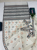White cotton jamdani saree with orange & black threads work.