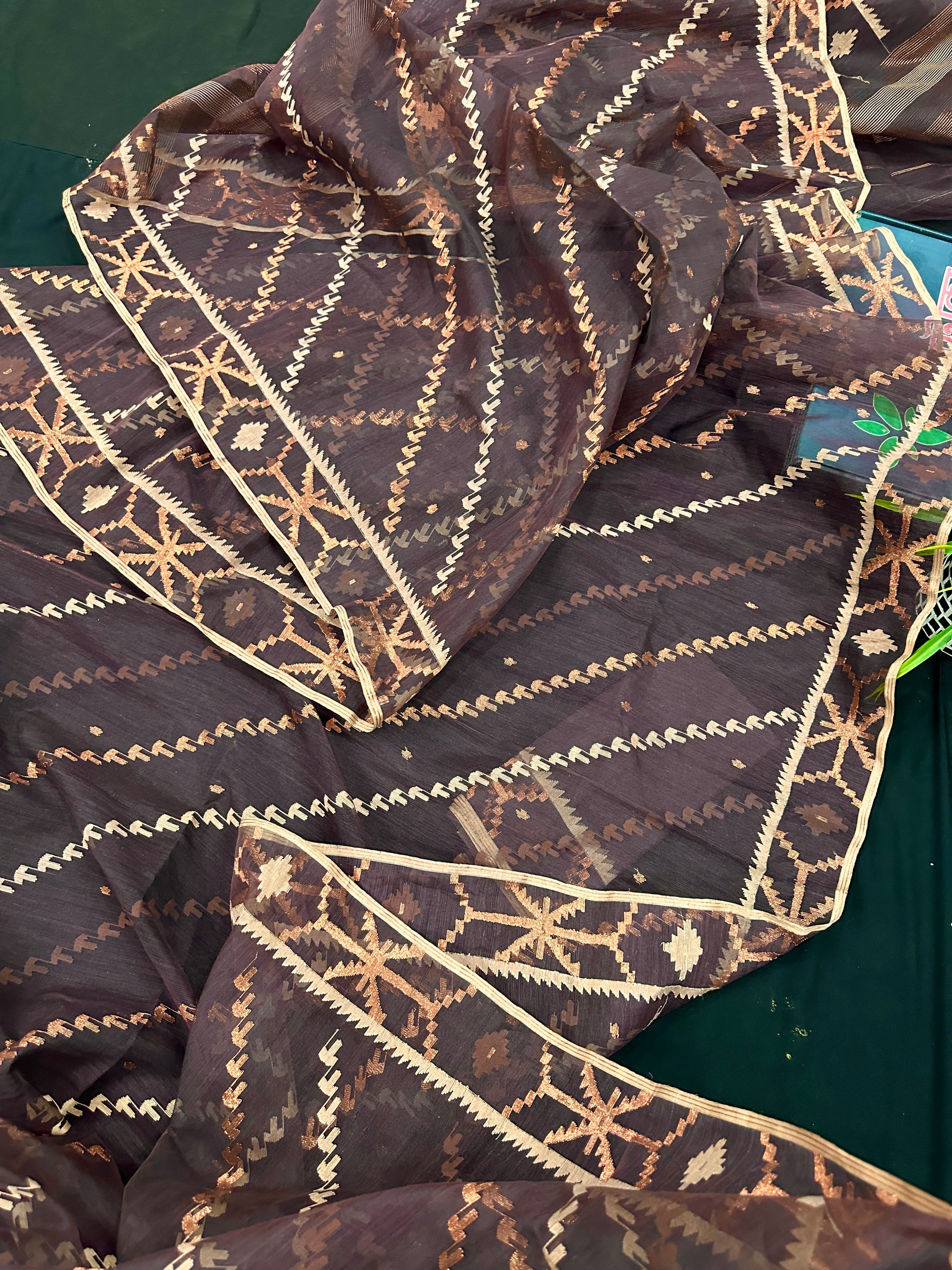 Brown colour jamdani saree with brown & off white threads work.