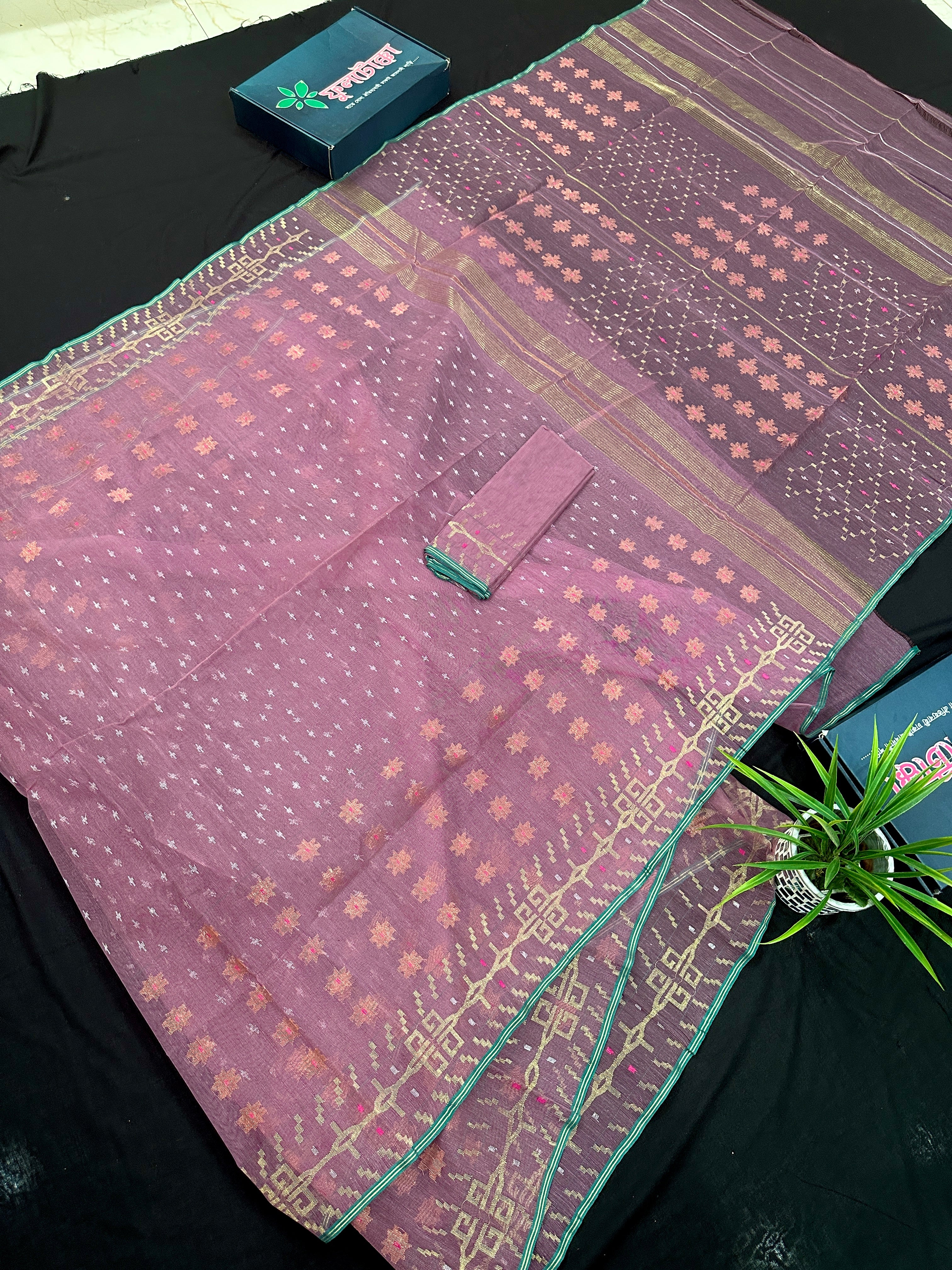 Onion colour jamdani saree with pink meena and green border.