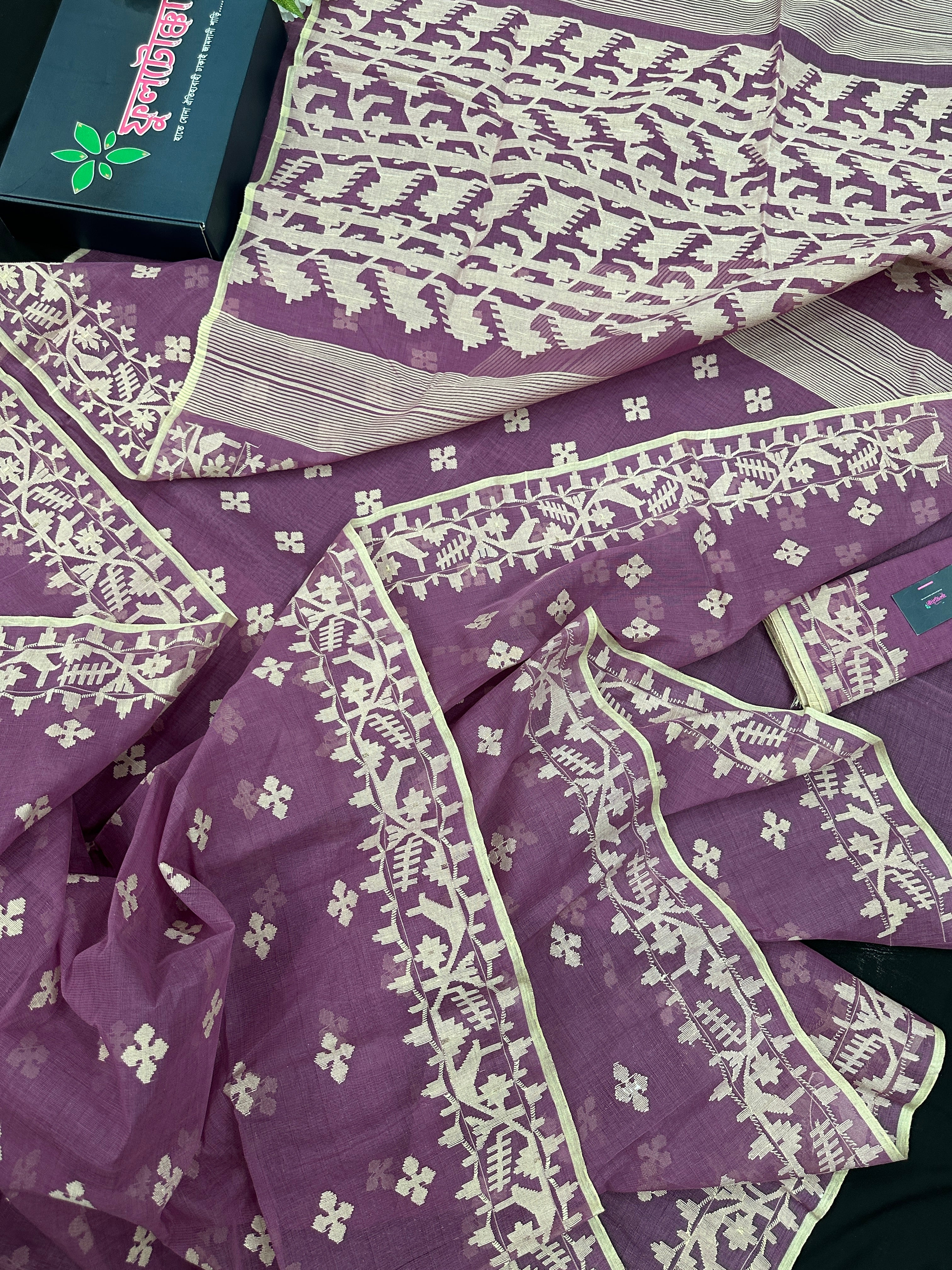 Onion cotton jamdani saree with yellowish threads work all over work.