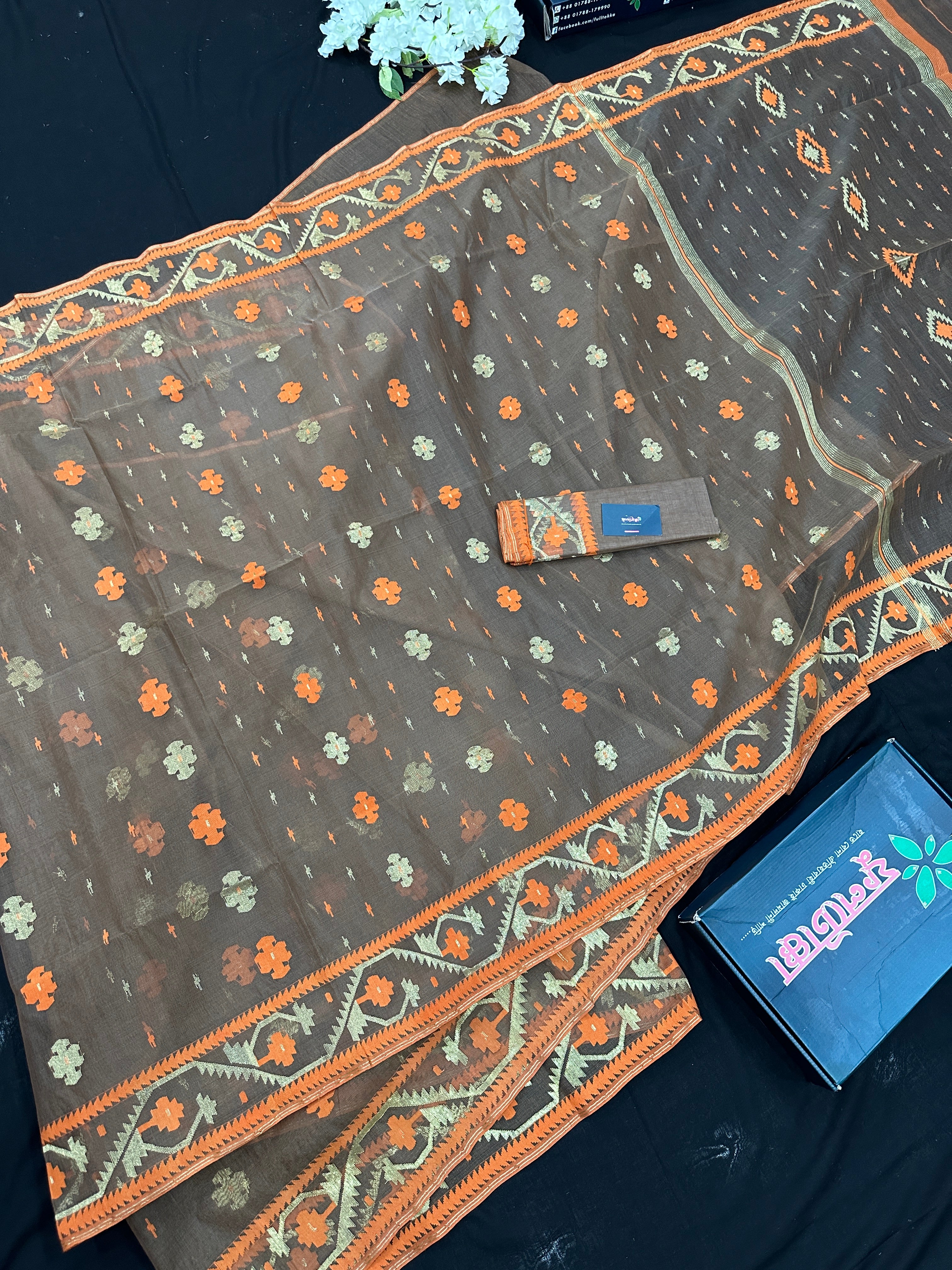 Peanut Brown dhakai jamdani saree with orange threads work & golden jori work all over soft count.