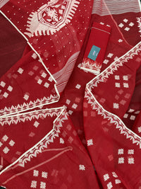 Radish Maroon cotton jamdani saree with white threads work all over work.