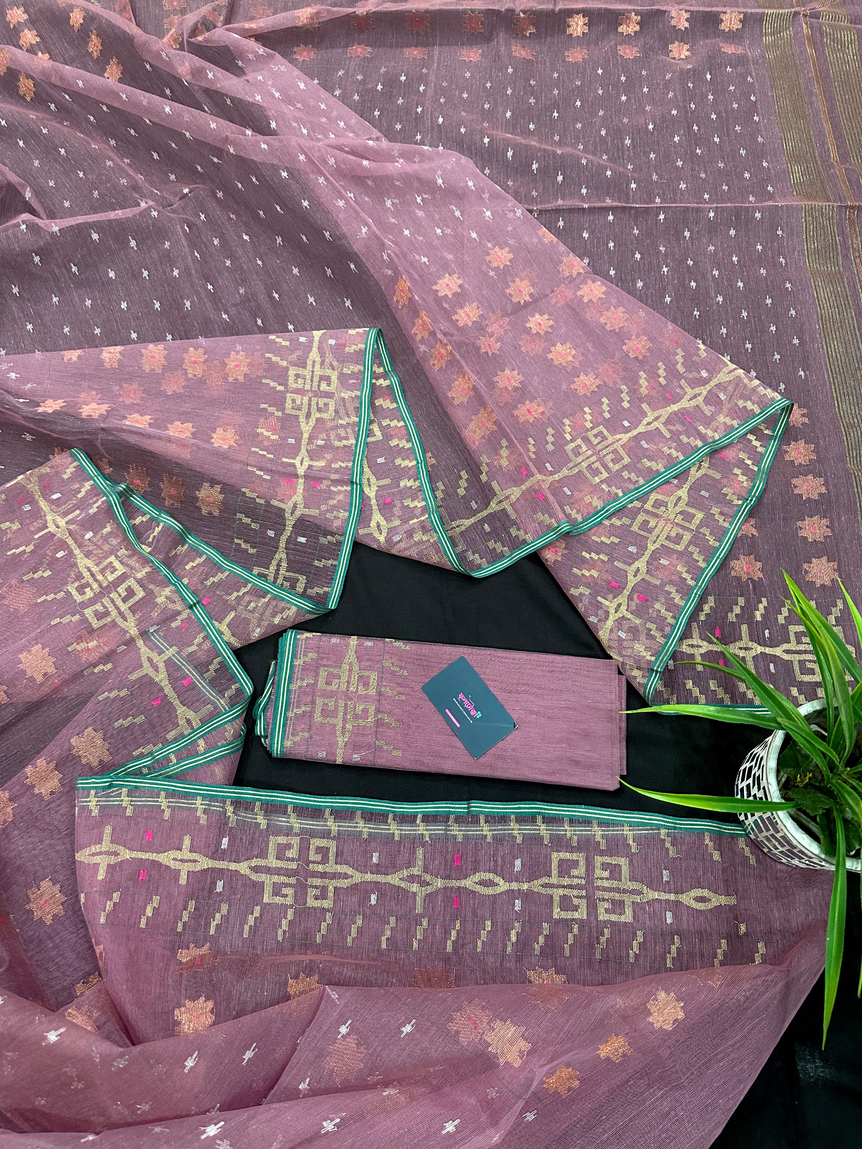 Onion colour jamdani saree with pink meena and green border.