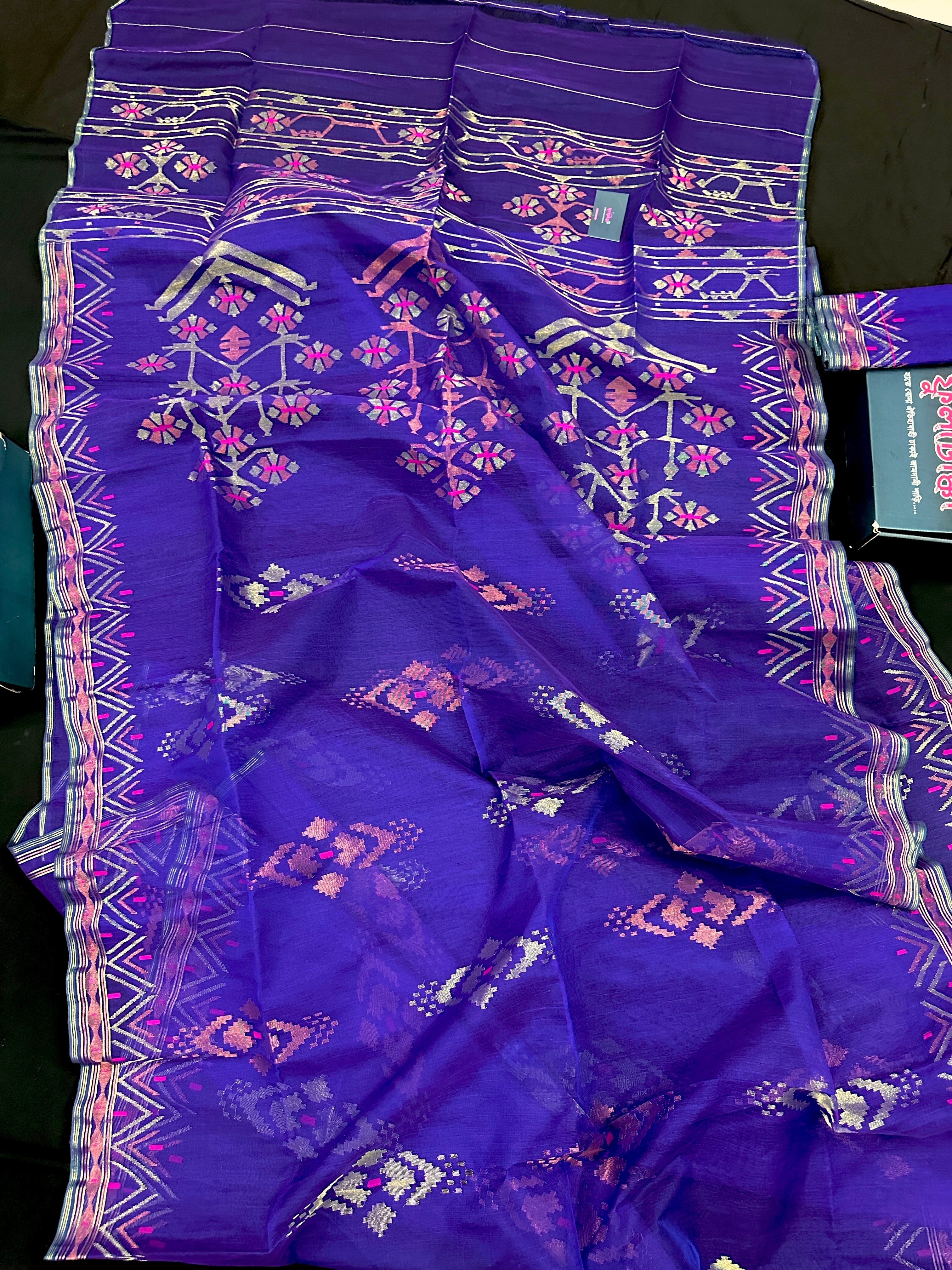 Purple exclusive jamdani saree with golden silver and copper jori work.
