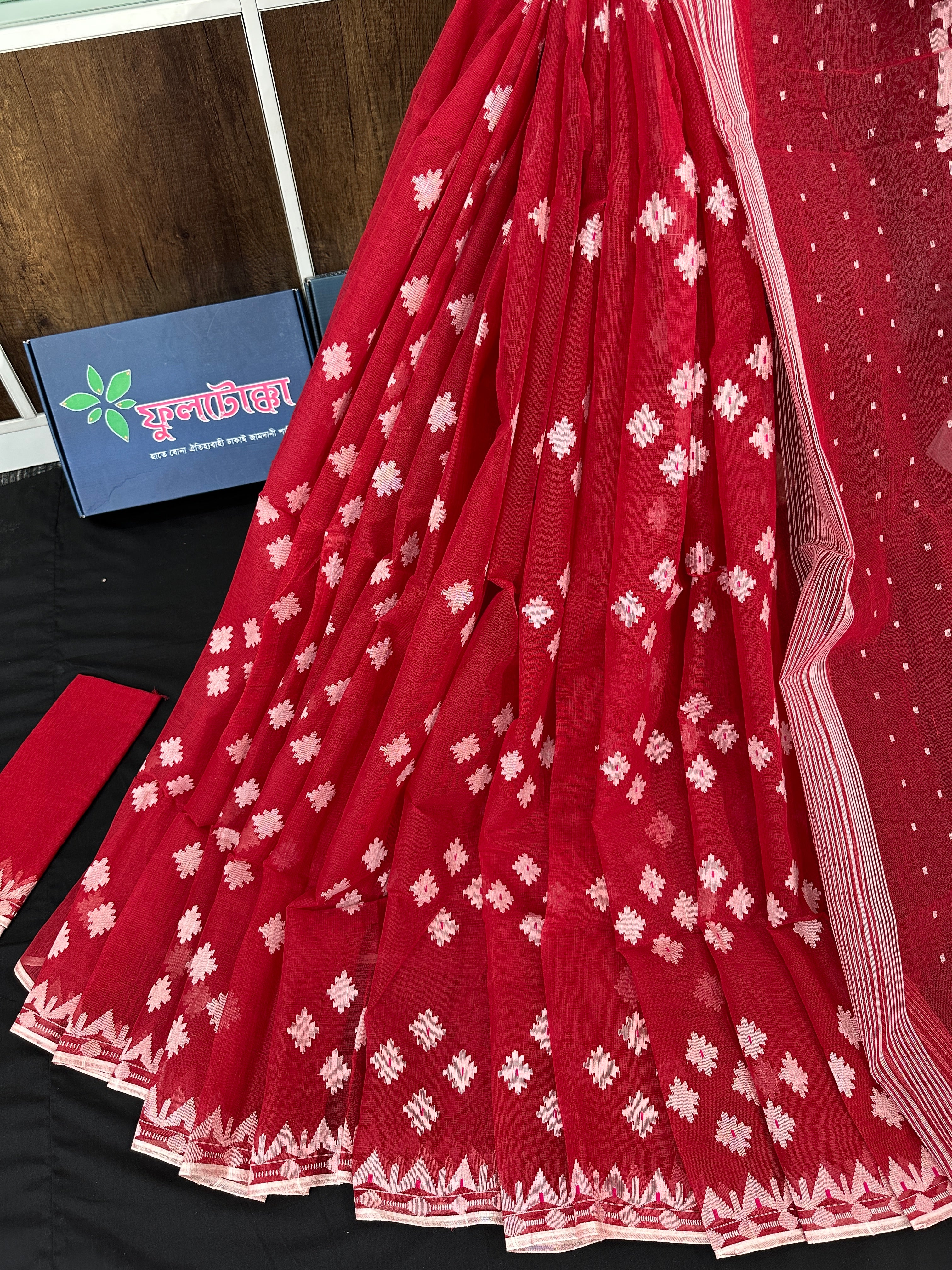 Radish Maroon cotton jamdani saree with white threads work all over work.