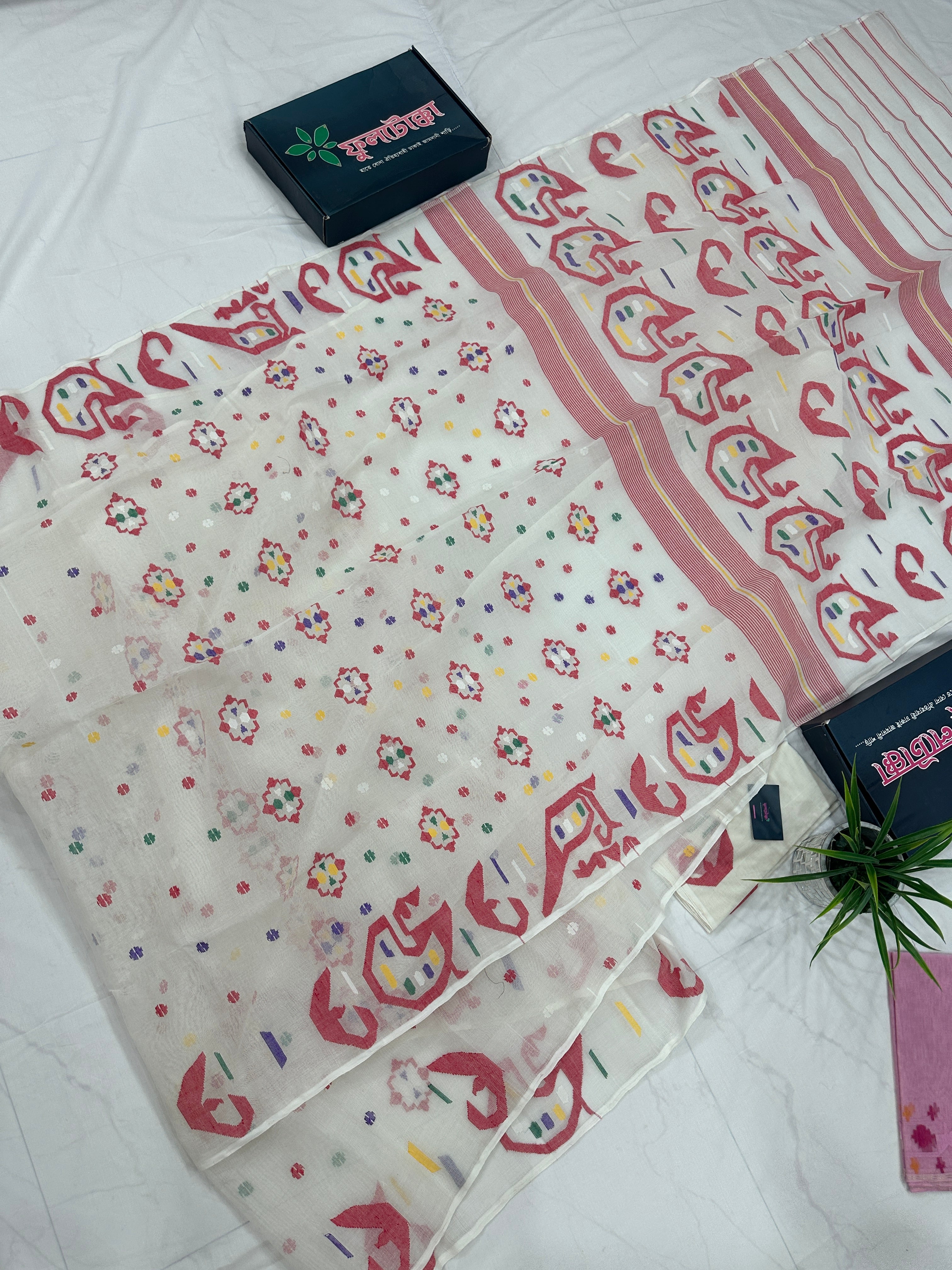 White cotton jamdani saree with multiple colour threads work and blouse piece.