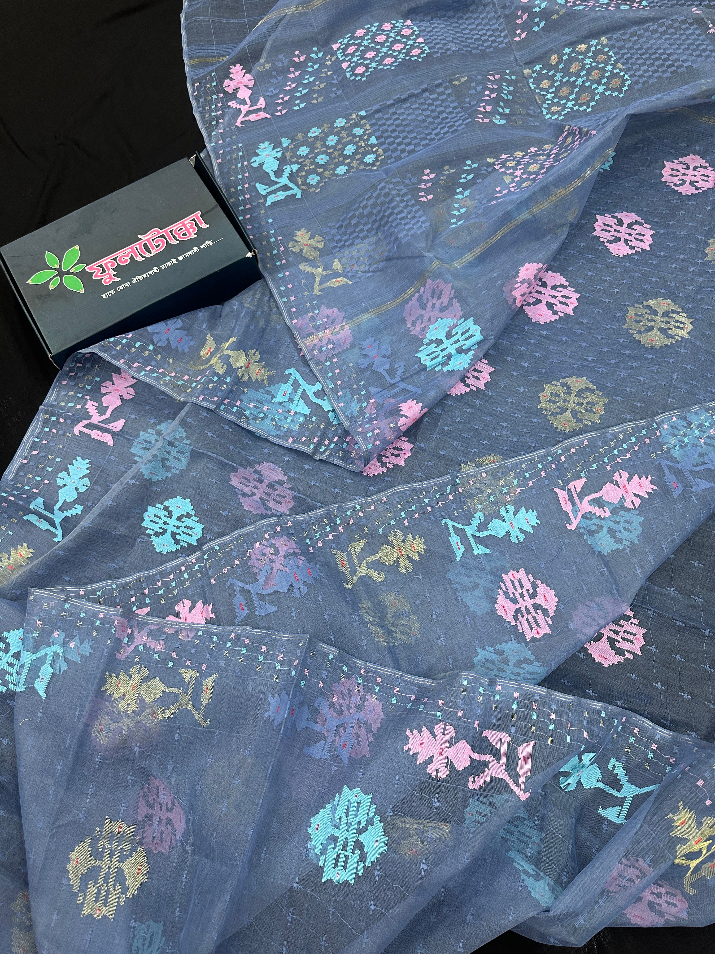 Powdery blue jamdani saree with pink blue and golden jori work.