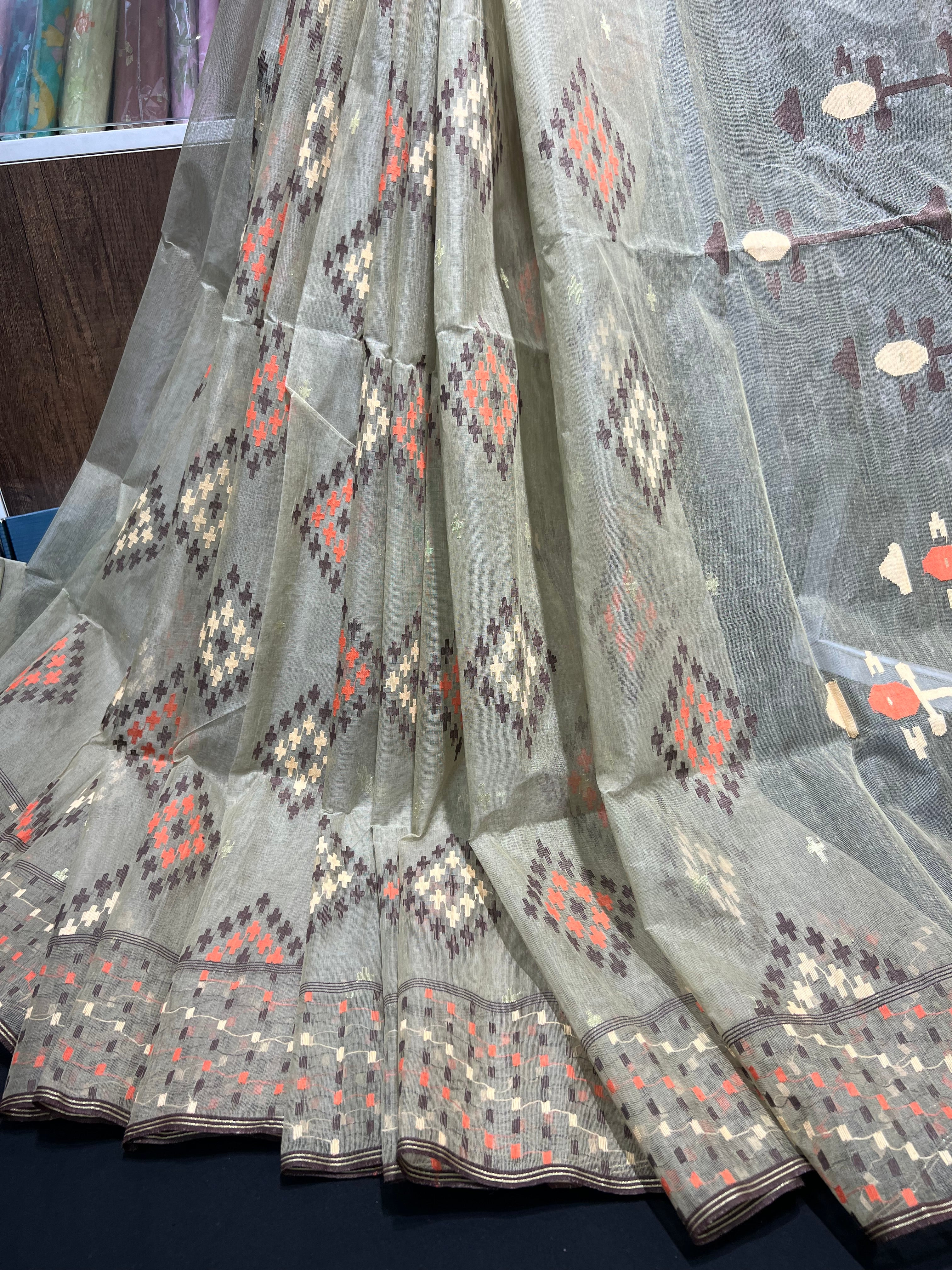 Dark olive halfsilk jamdani saree with orange off white coffe threads work