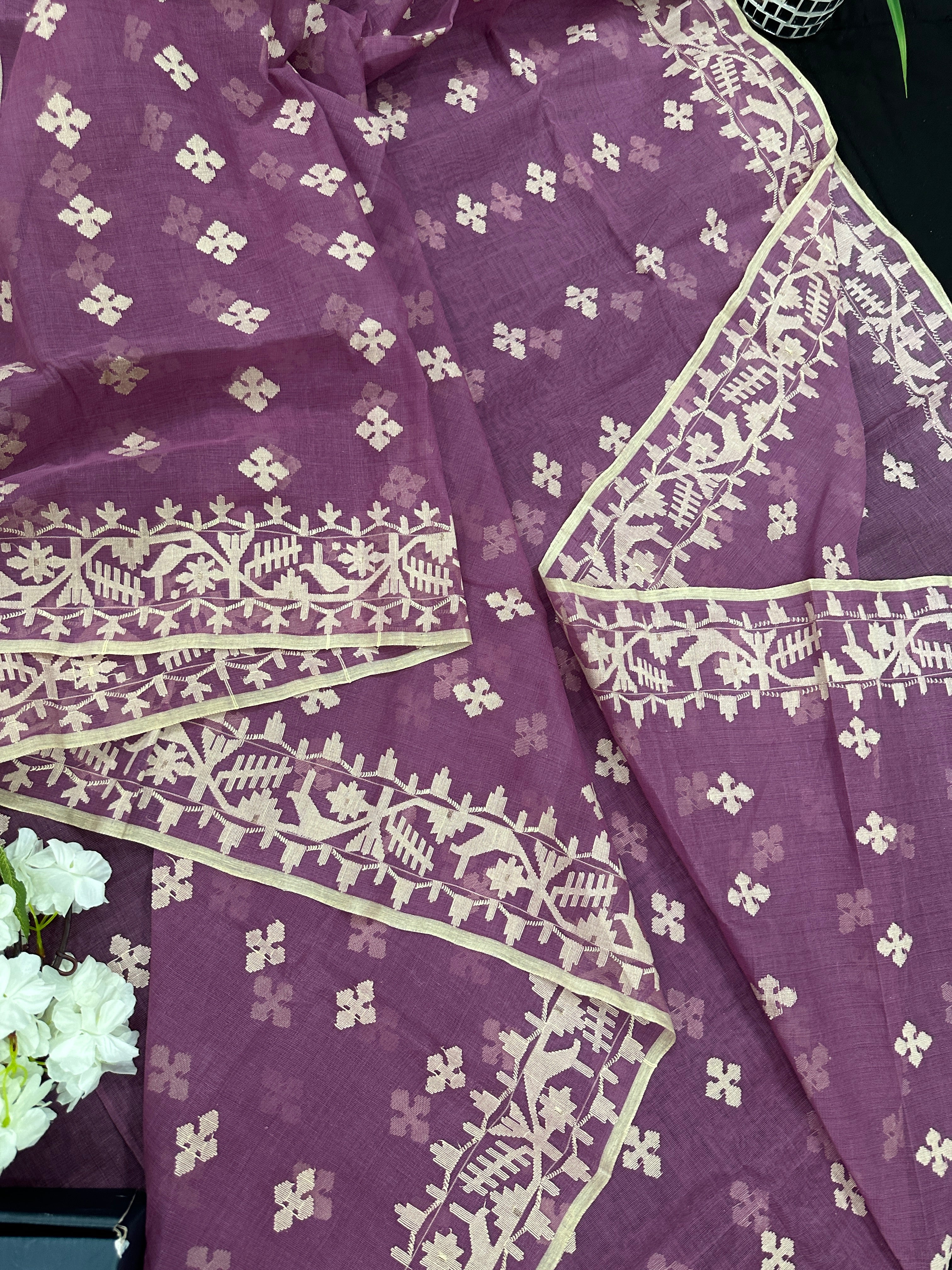 Onion cotton jamdani saree with yellowish threads work all over work.