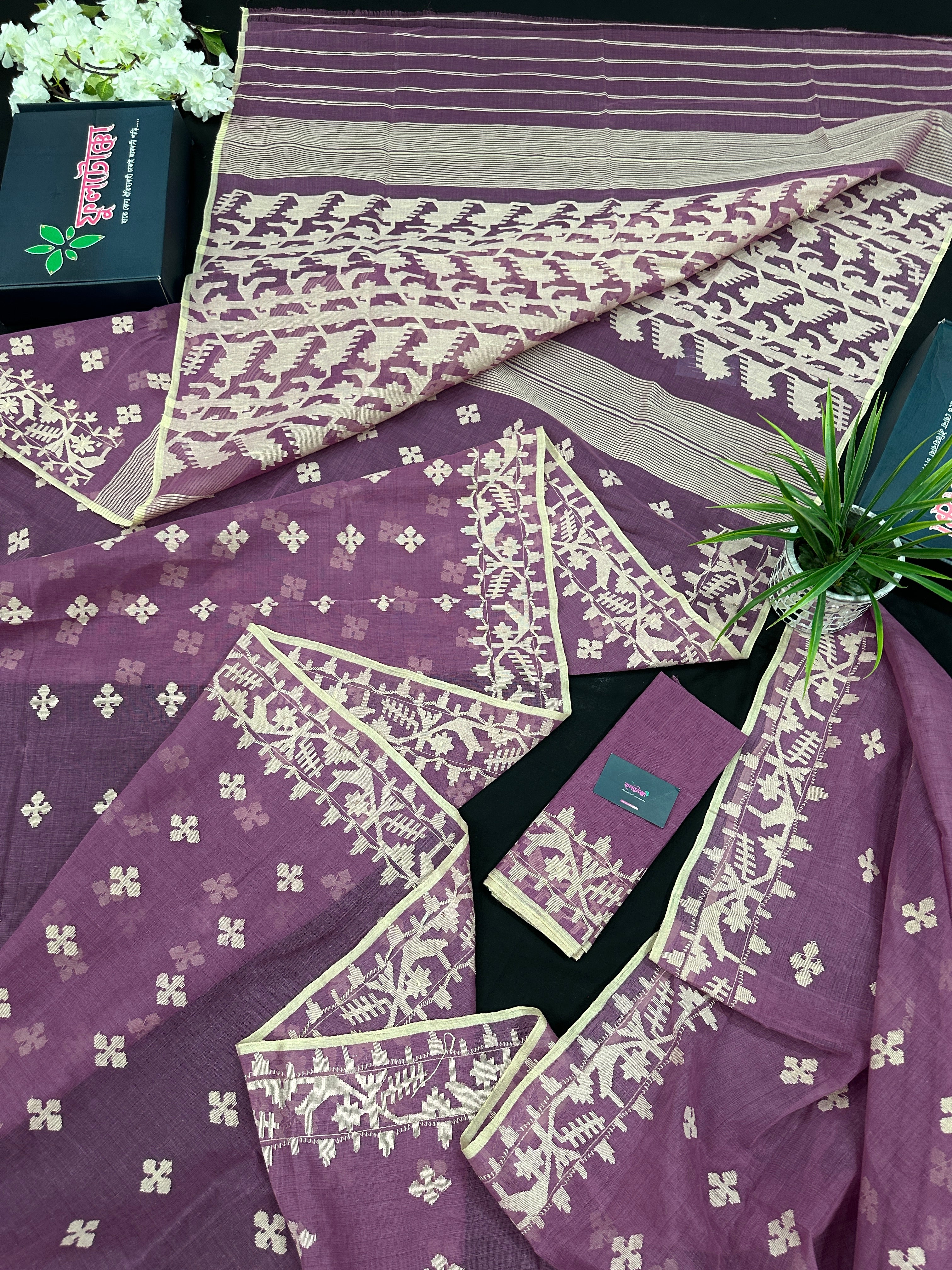 Onion cotton jamdani saree with yellowish threads work all over work.
