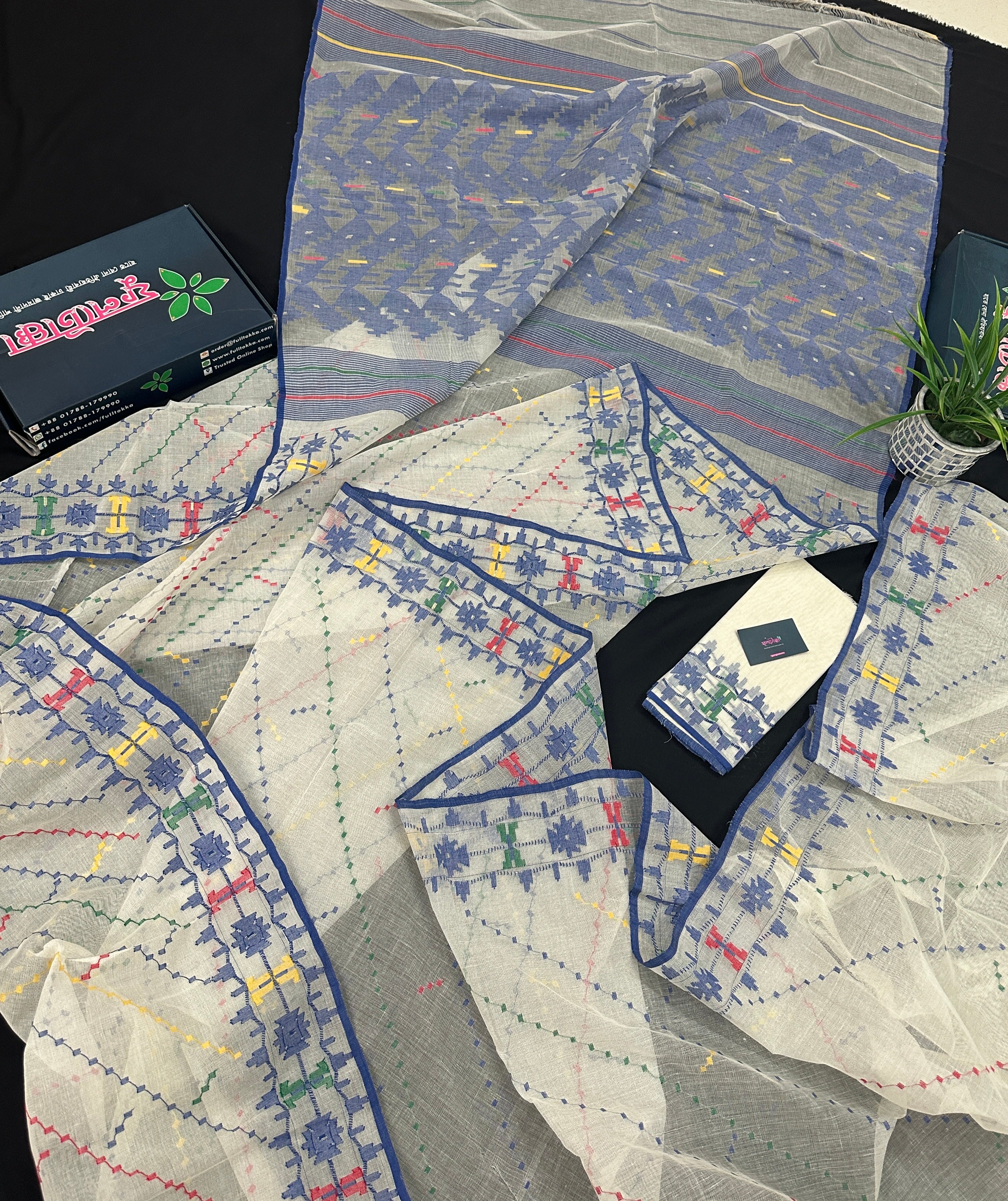 White cotton jamdani saree with blue yellow red green threads work& blouse piece.