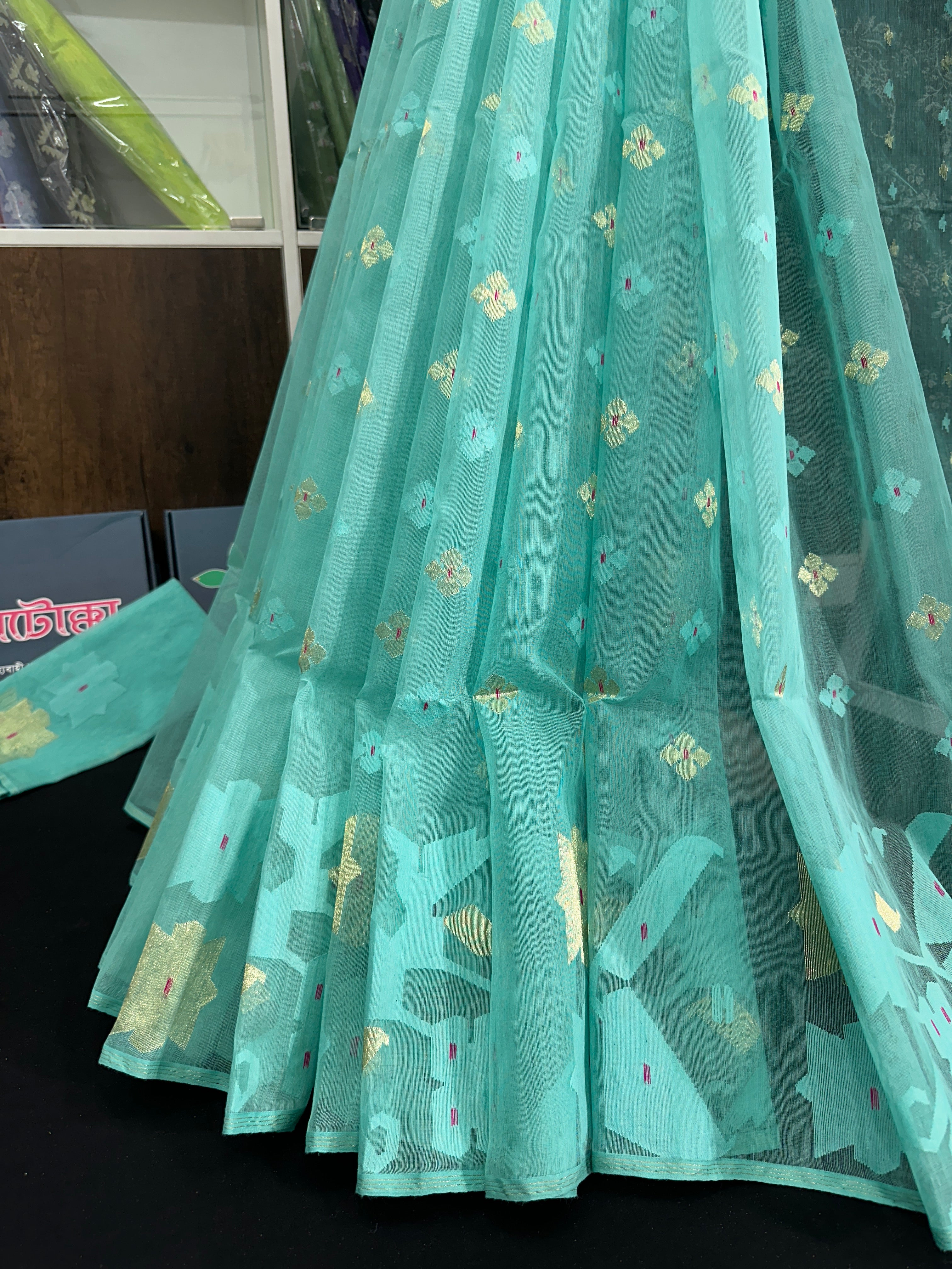 Sky blue halfsilk jamdani saree with golden jori work and self threads work