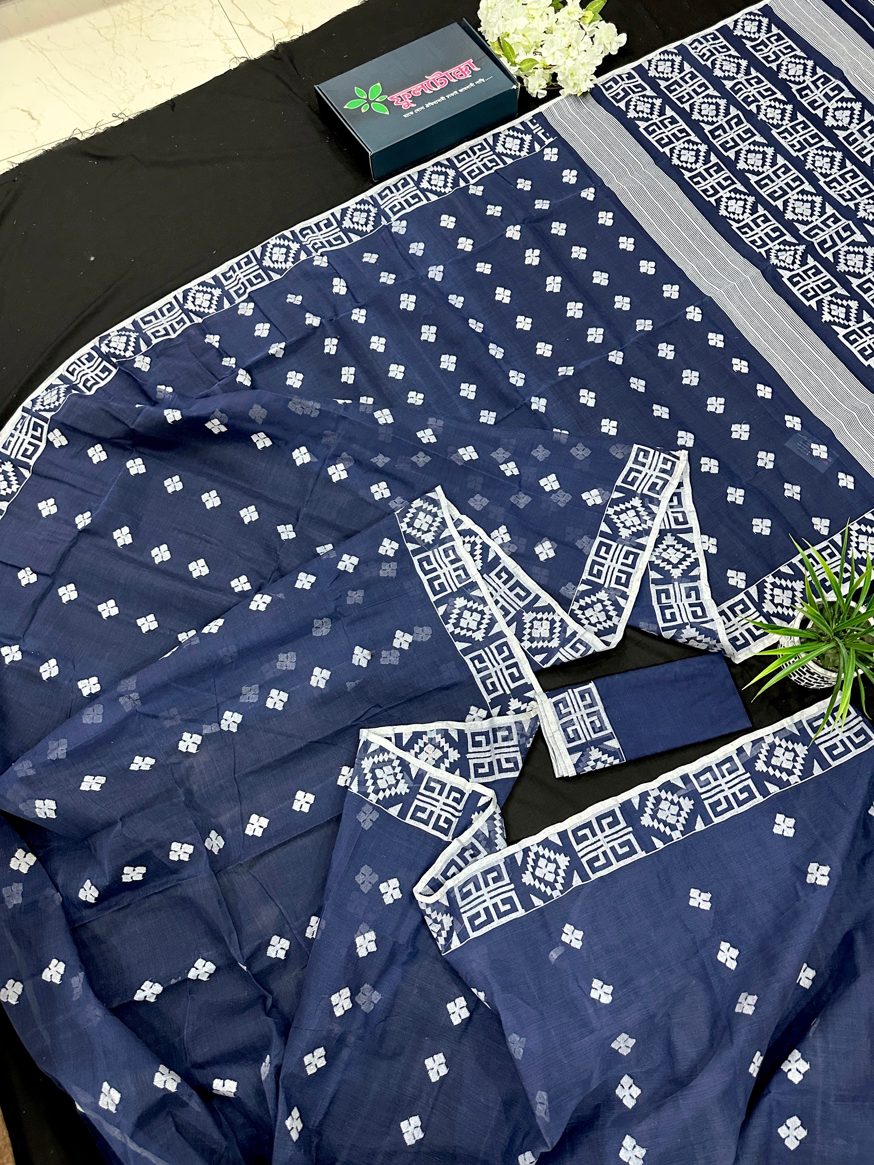 Deep blue jandani saree with white threads all over work.