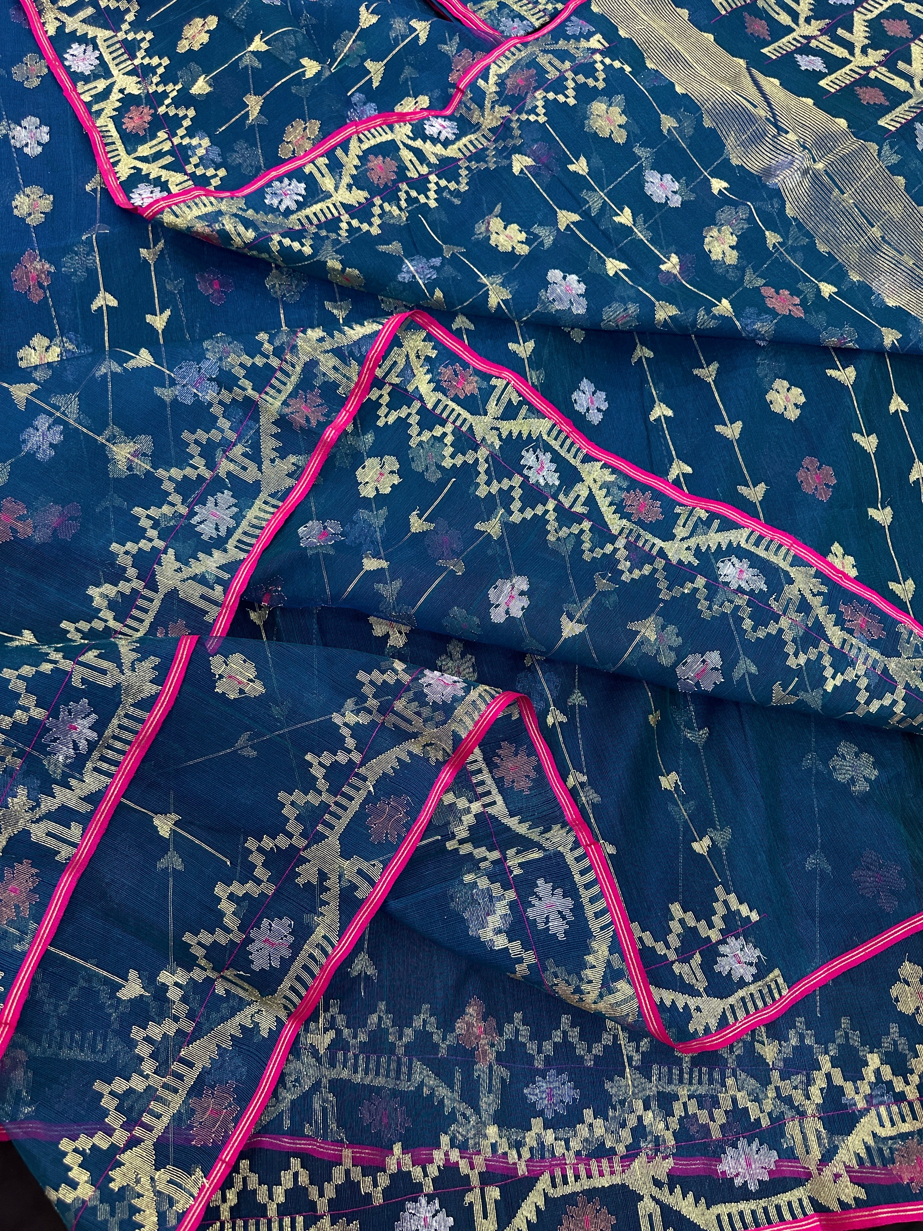 Peacock blue jamdani saree with golden silver copper jori work and pink border