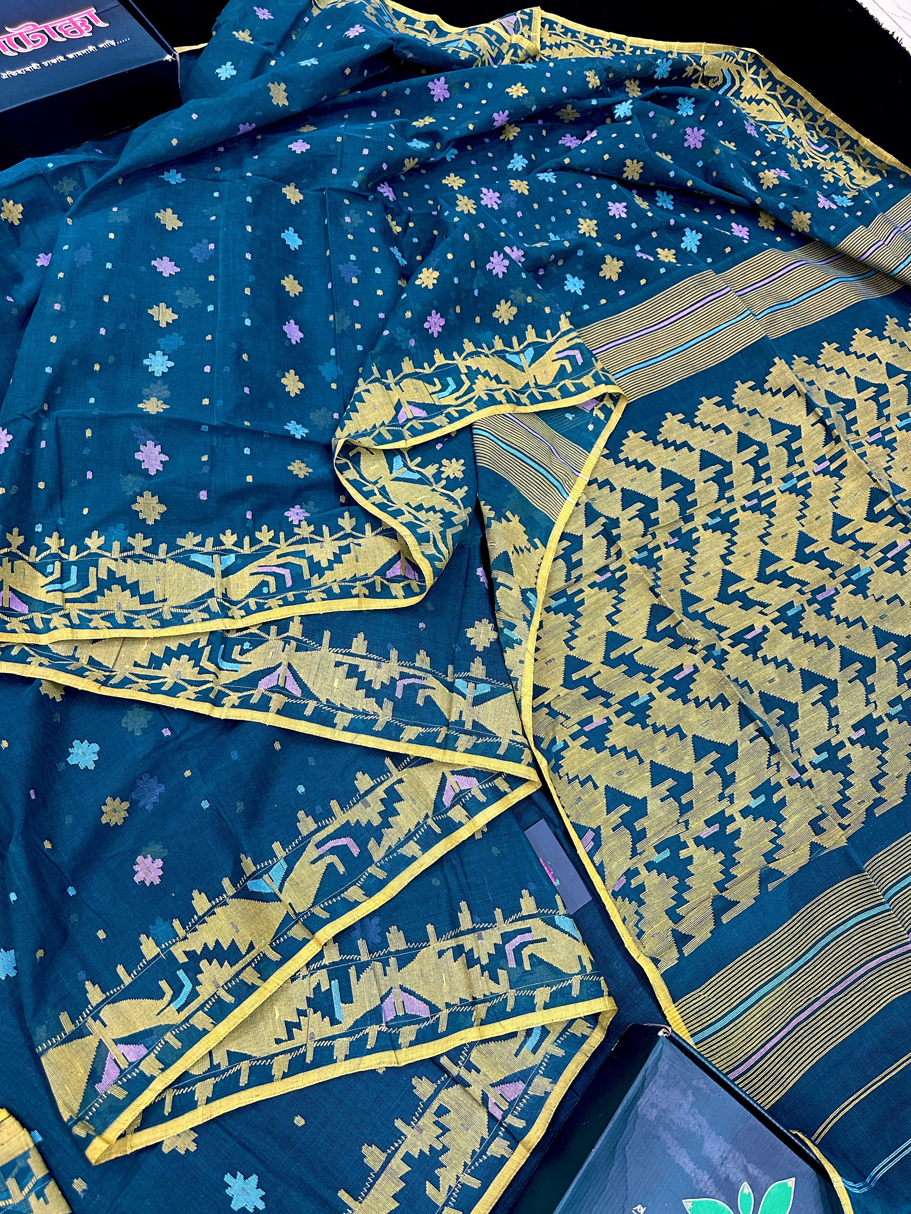 Peacock blue cotton jamdani saree with yellow threads work all over soft count