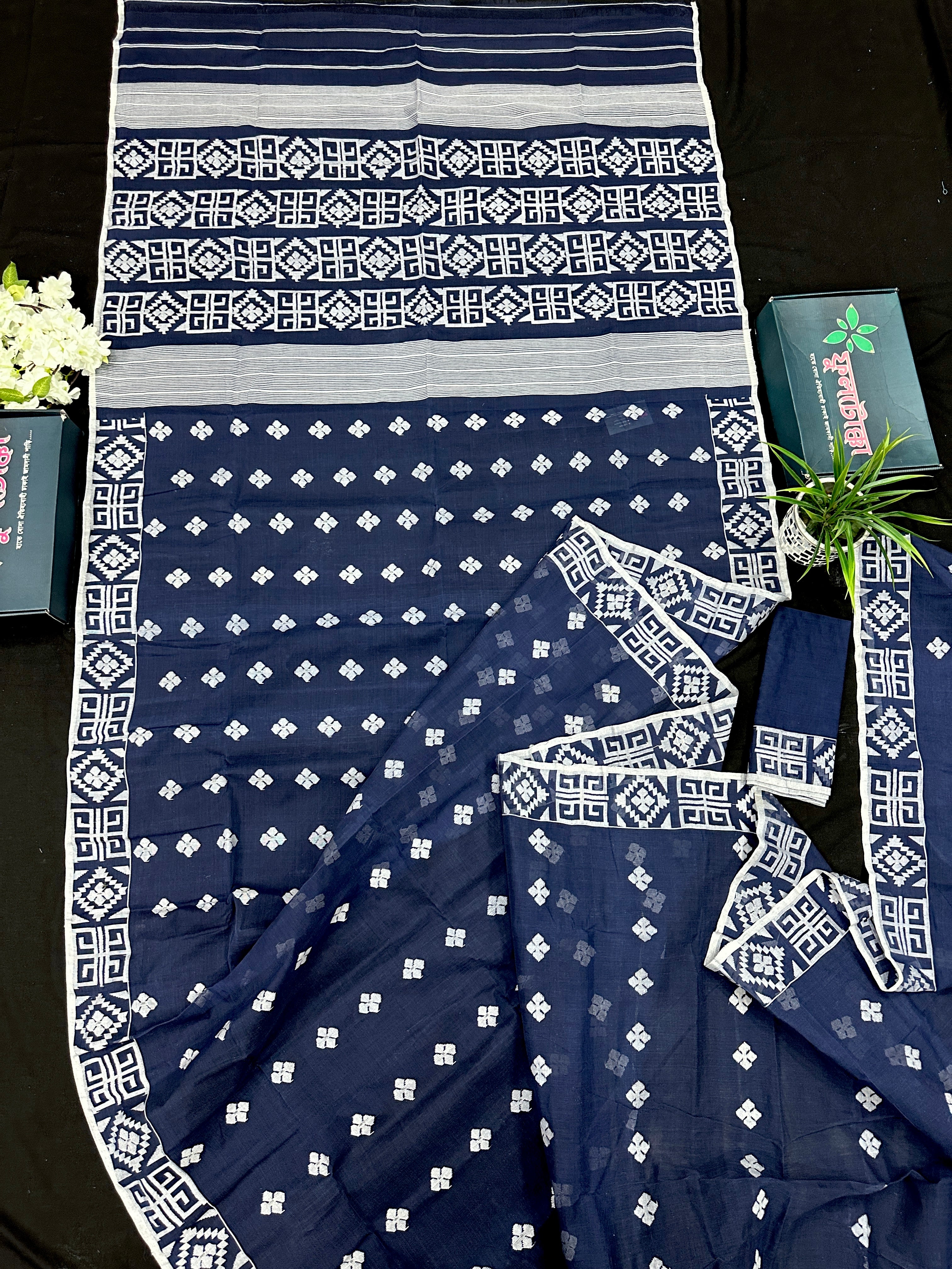 Deep blue jandani saree with white threads all over work.