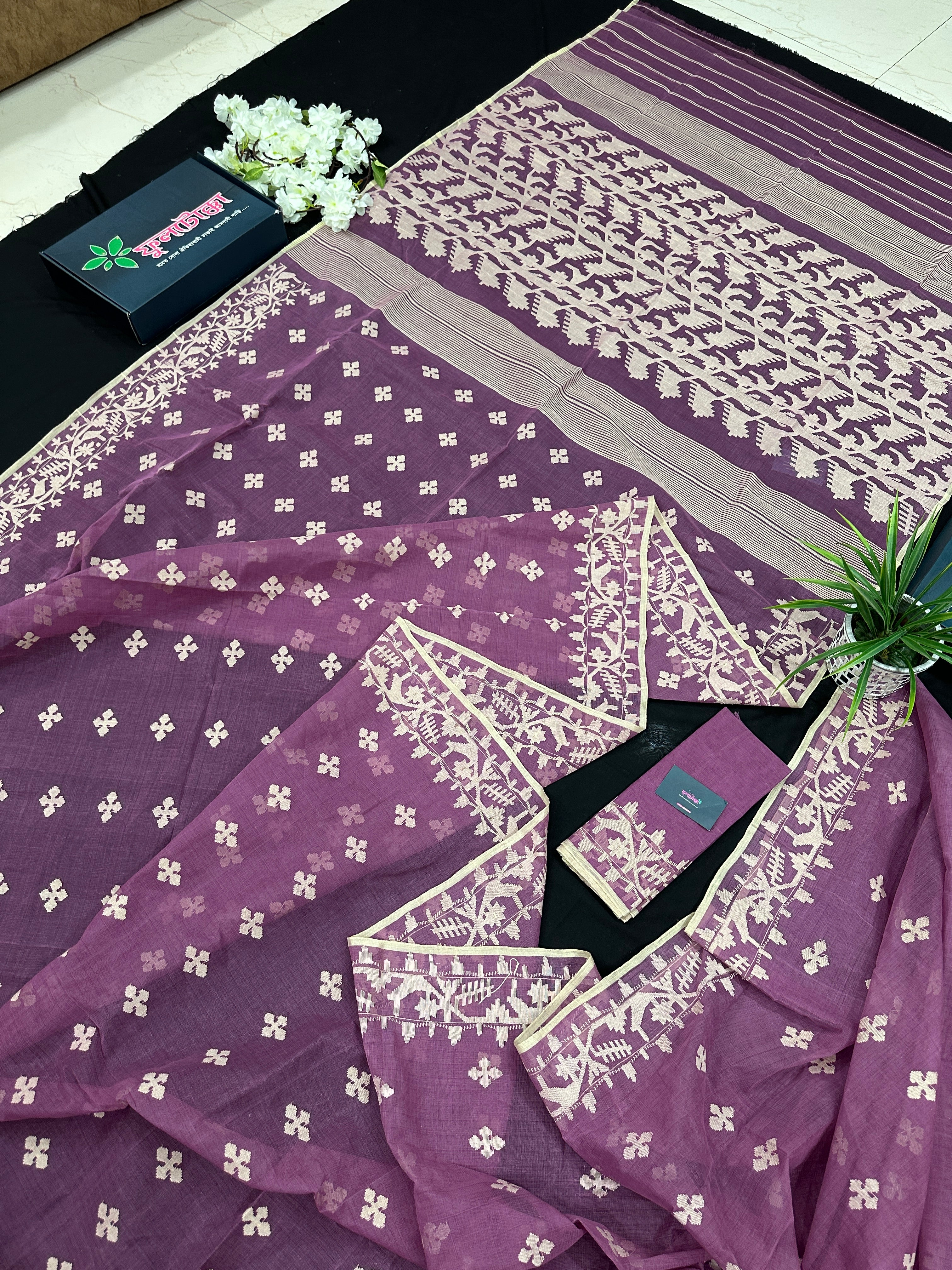 Onion cotton jamdani saree with yellowish threads work all over work.