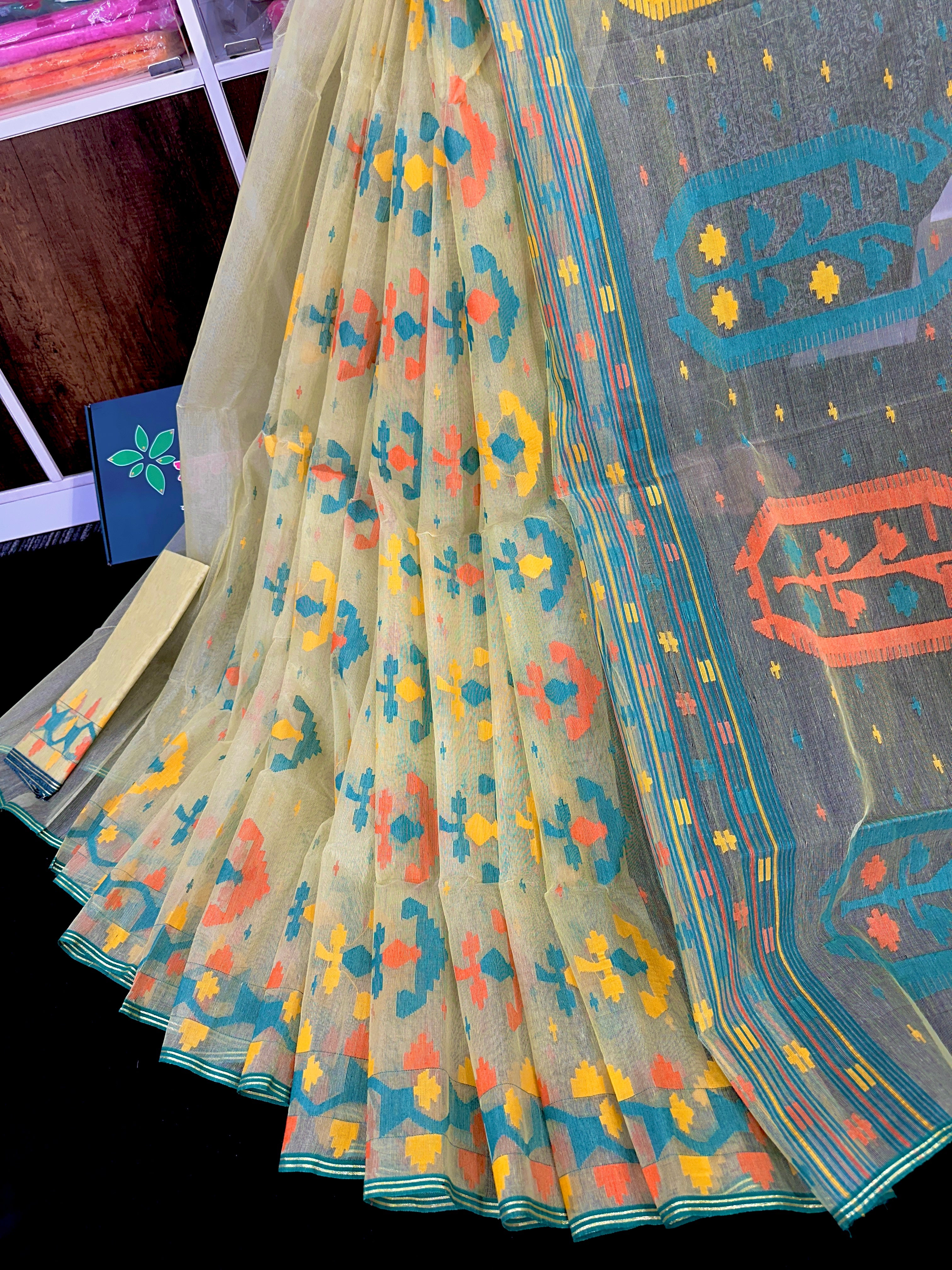 Basonti colour halfsilk jamdani saree with orange blue yellow threads work