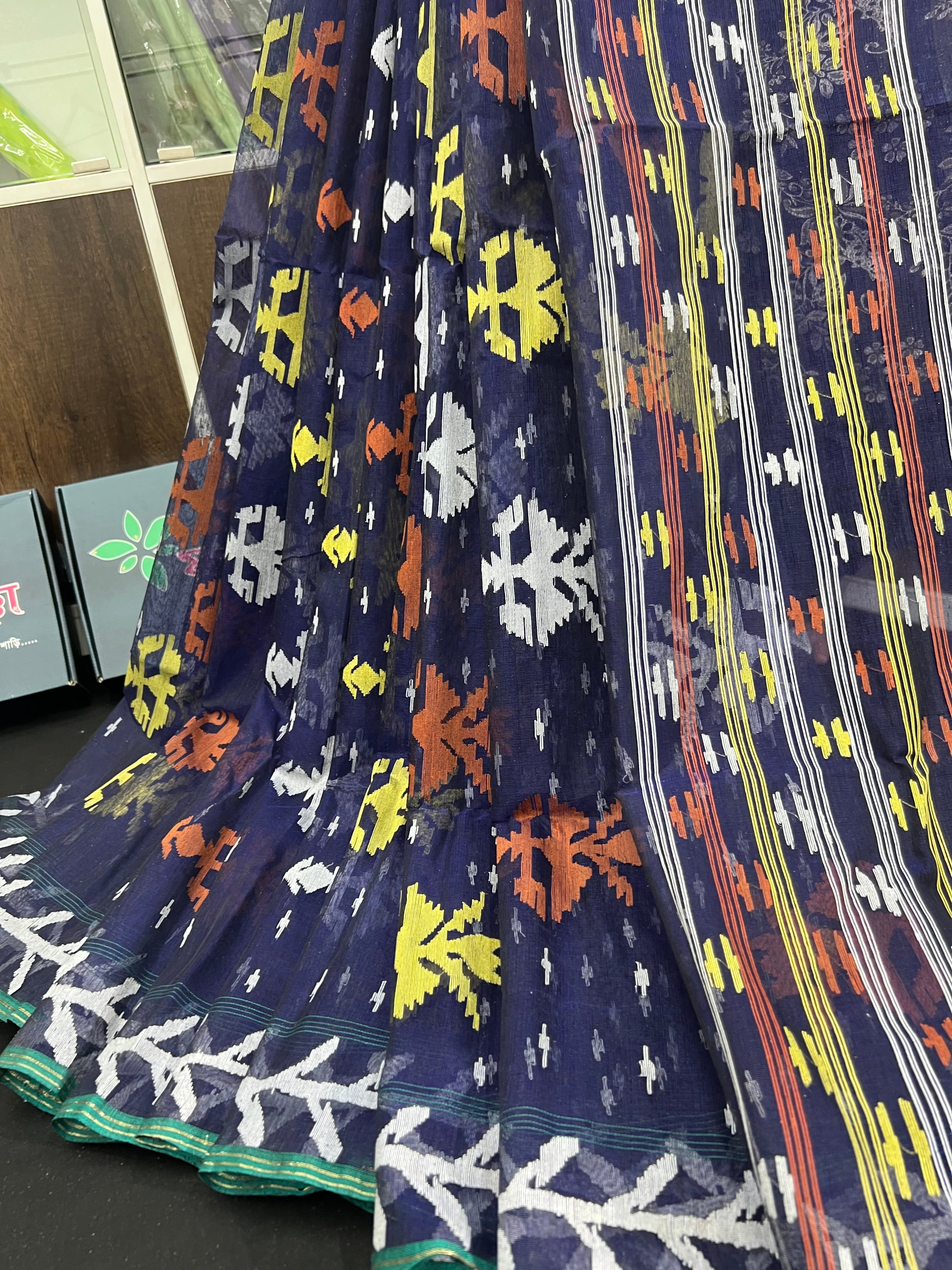 Deep blue halfsilk jamdani saree with orange yellow white threads work