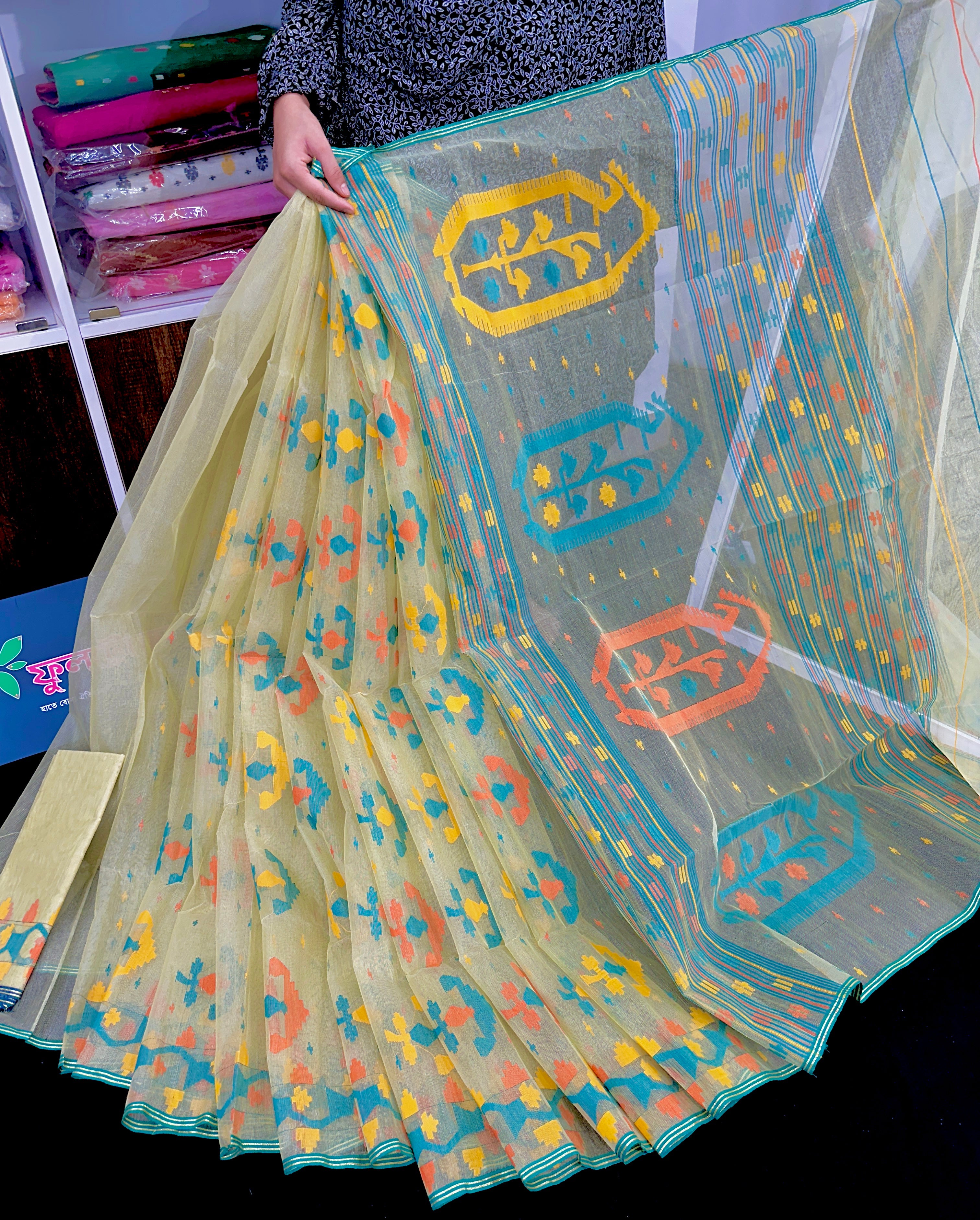 Basonti colour halfsilk jamdani saree with orange blue yellow threads work