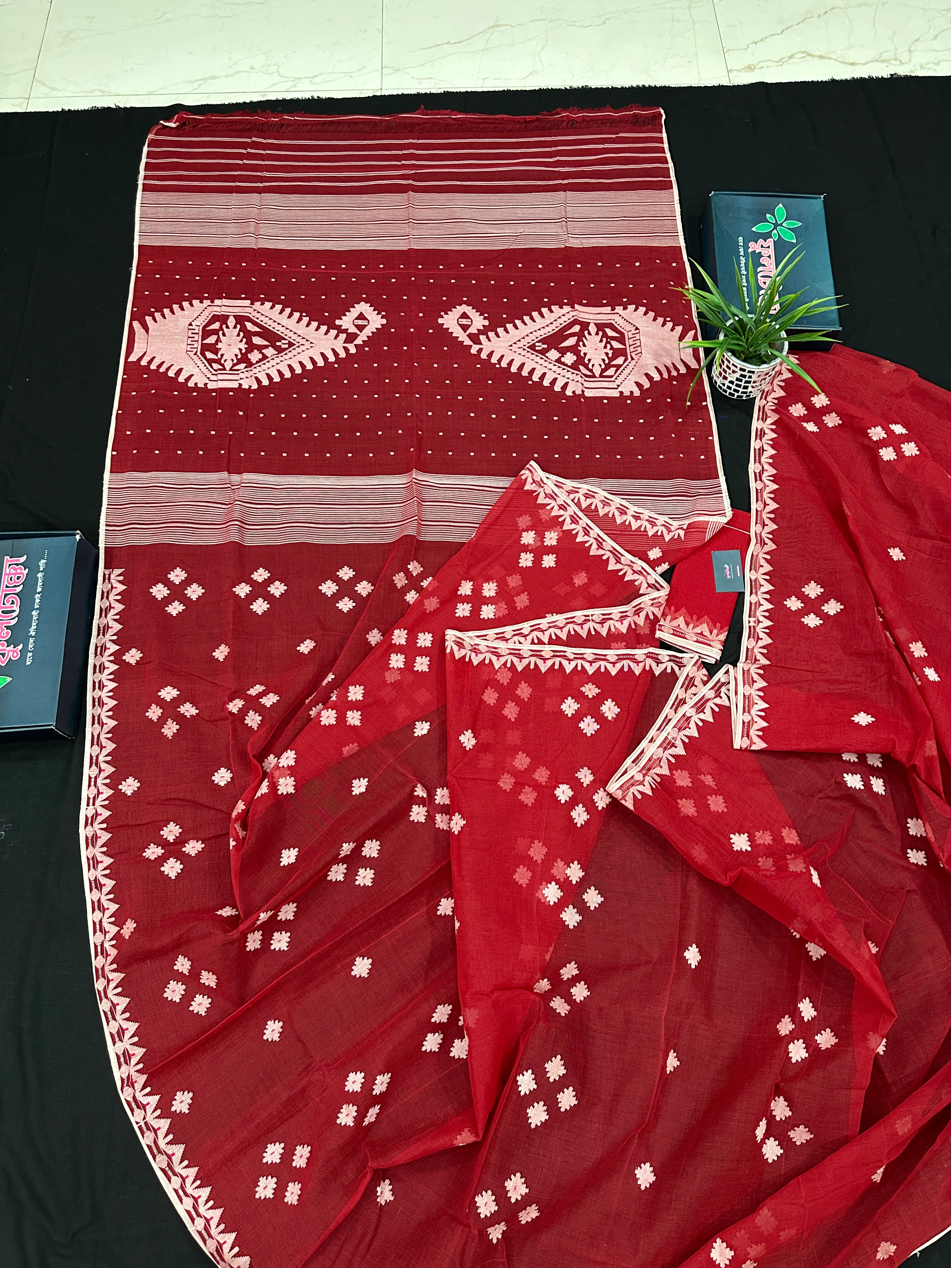 Radish Maroon cotton jamdani saree with white threads work all over work.