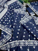 Deep blue jandani saree with white threads all over work.