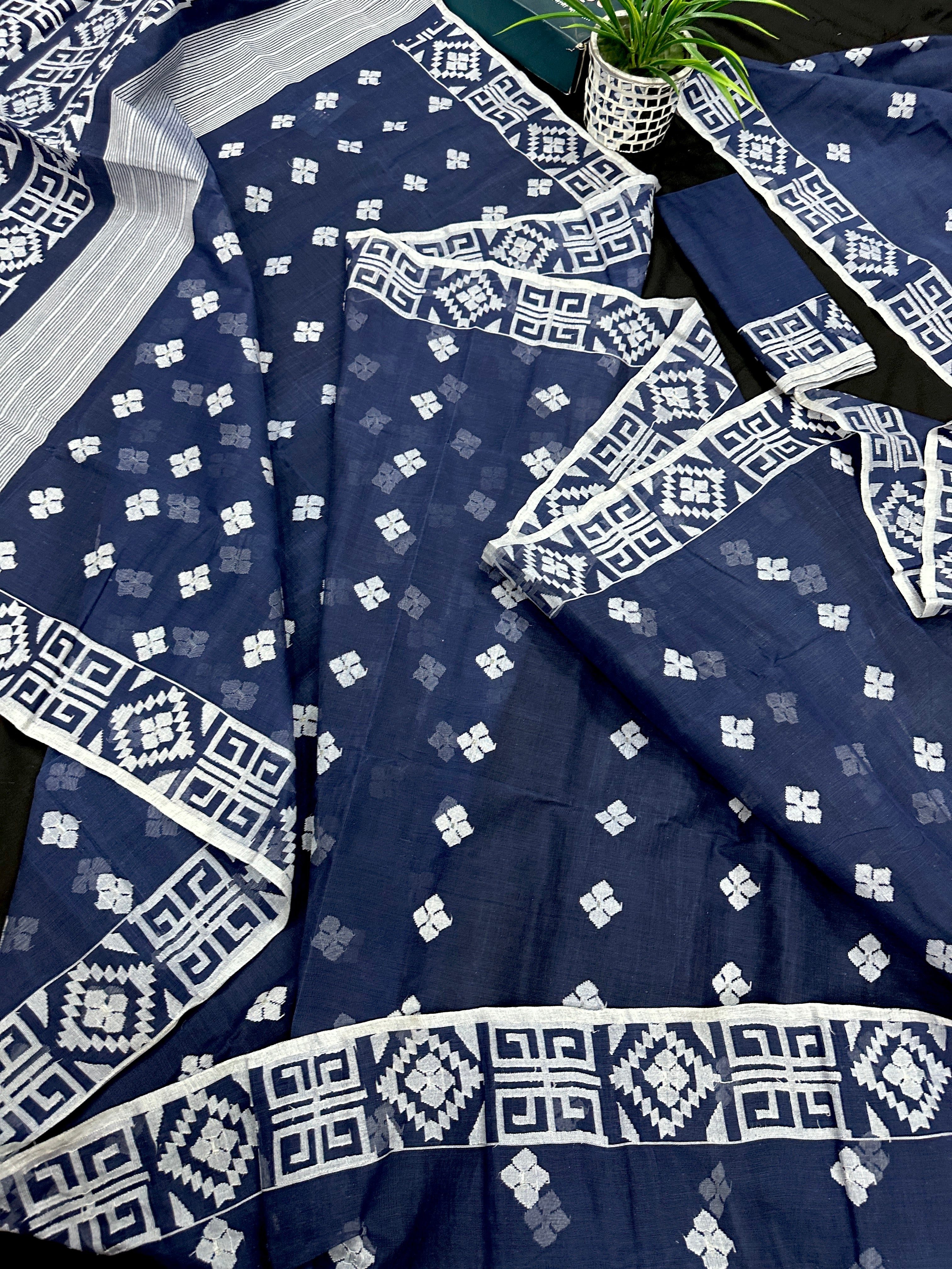 Deep blue jandani saree with white threads all over work.