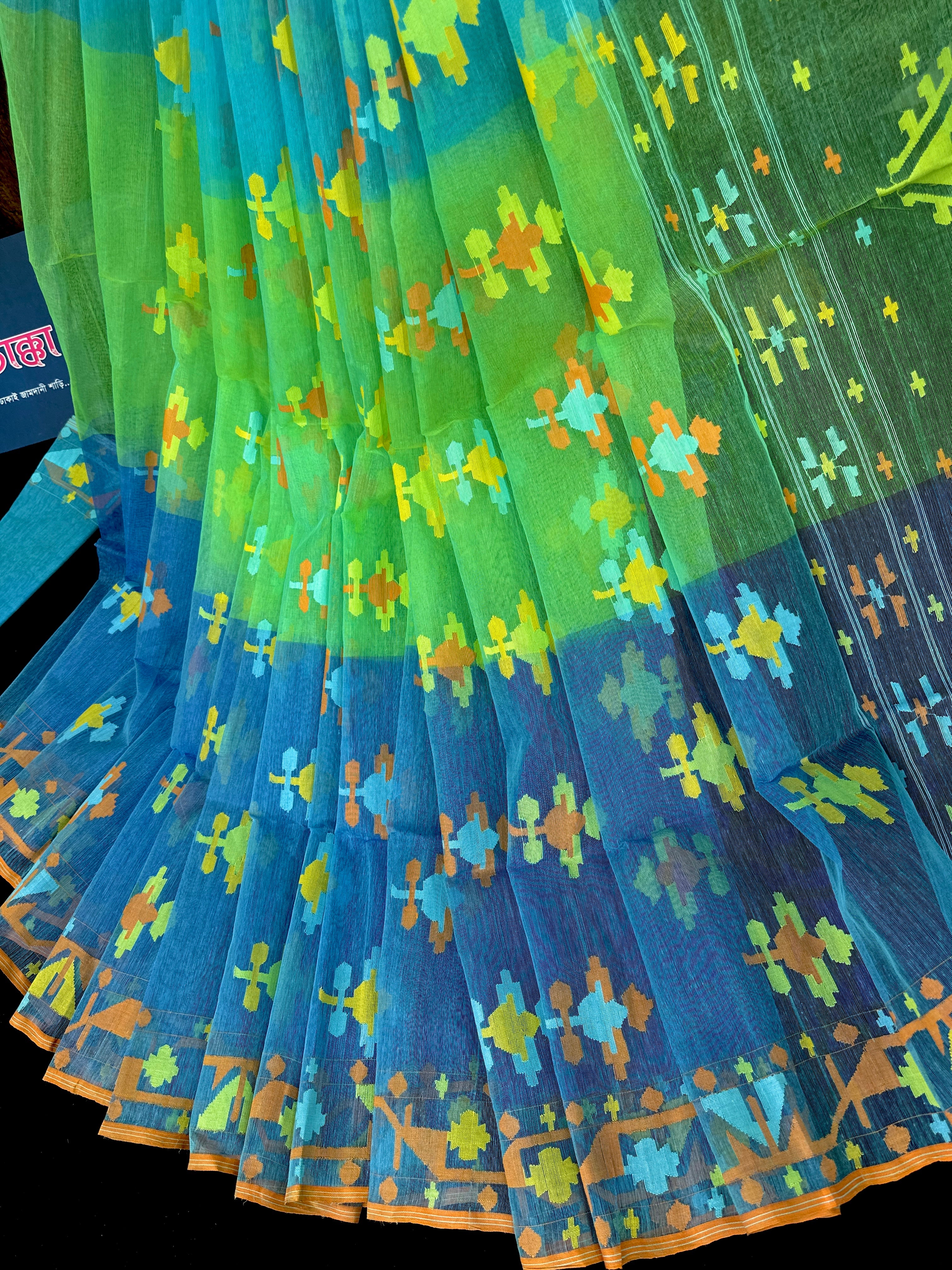 Tripple shaded halfsilk jamdani saree with yellow blue orange threads work.