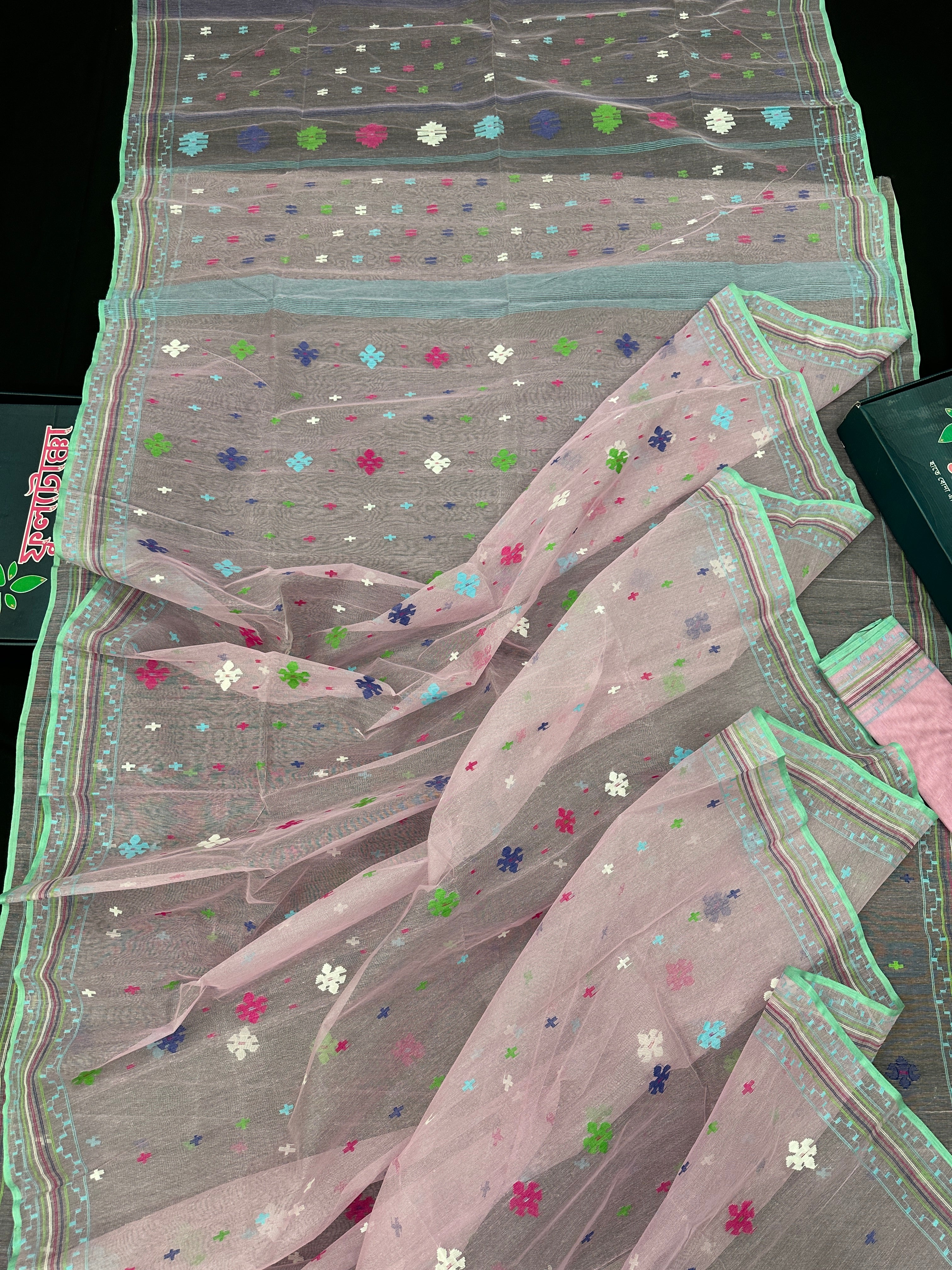 Baby pink jamdani saree with blue pink green threats work and blouse piece.