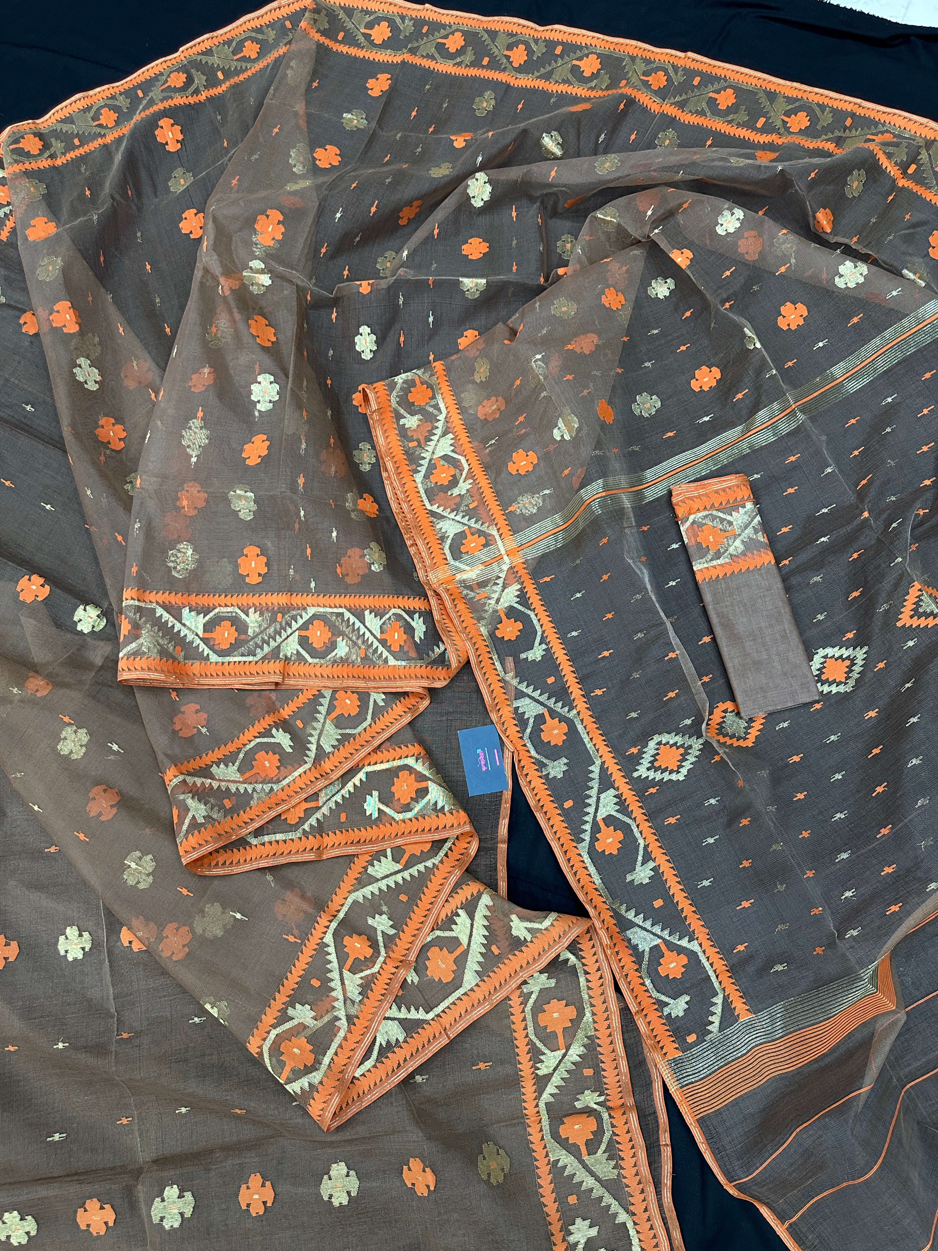 Peanut Brown dhakai jamdani saree with orange threads work & golden jori work all over soft count.