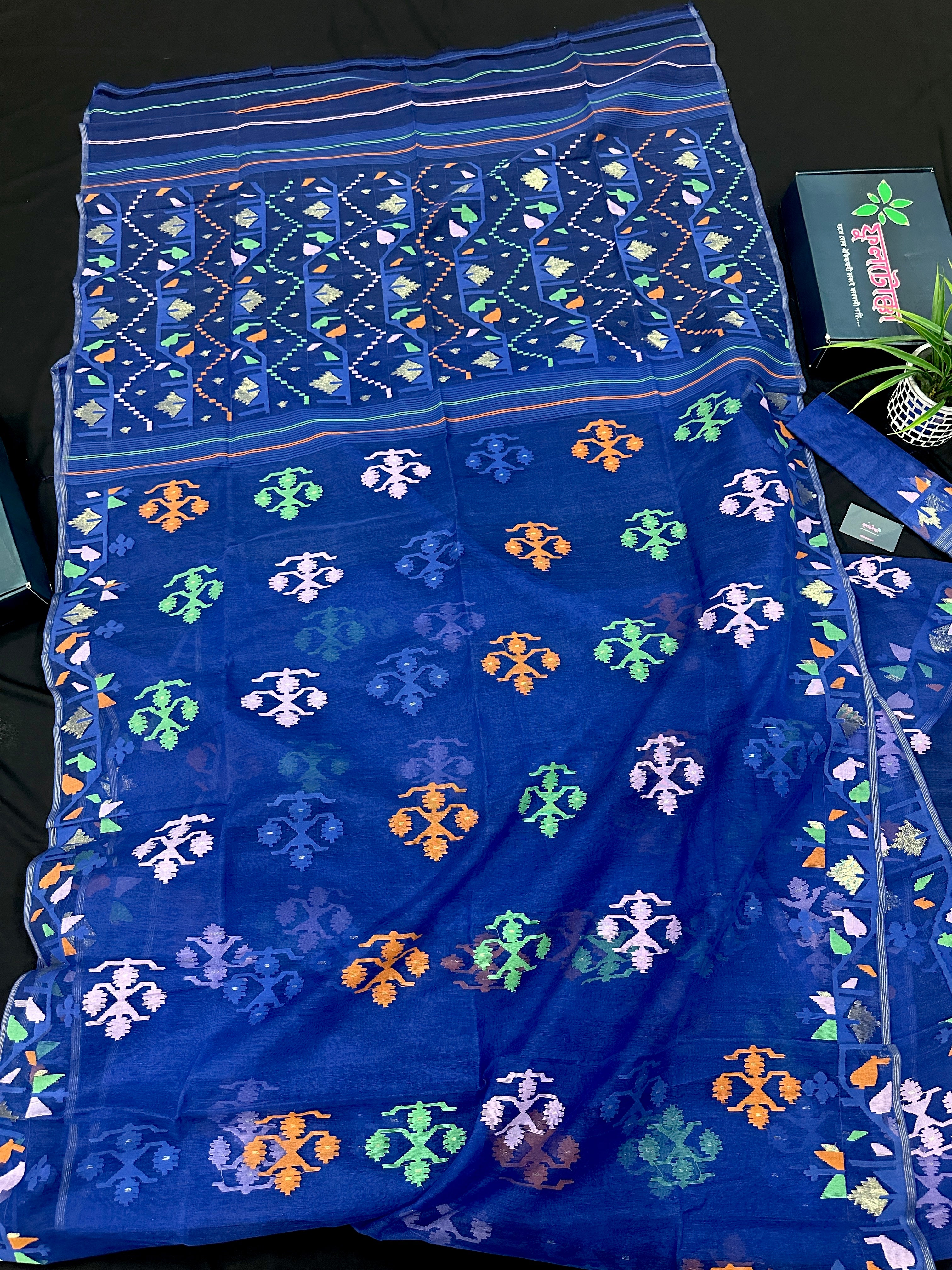 Royal blue jamdani saree with green pink blue orange threads work.