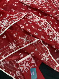 Maroon jamdani saree with white thread work.